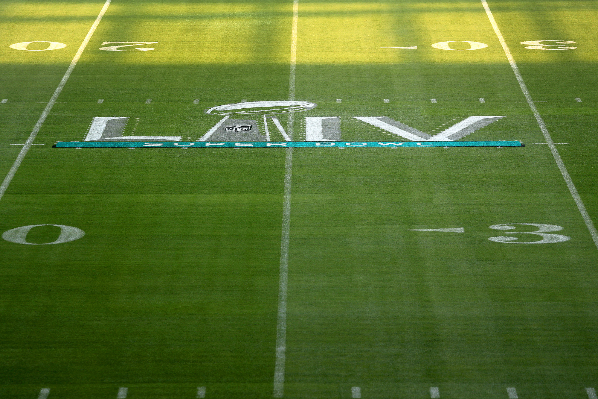 Workers paint the field at Hard Rock Stadium Stadium in Miami Gardens, Fla., on Tuesday, Jan. 21, 2020, in anticipation of Super Bowl LIV, featuring the Kansas City Chiefs against the San Francisco 49ers on February 2, 2020. (Mike Stocker/Sun Sentinel/Tribune News Service via Getty Images)