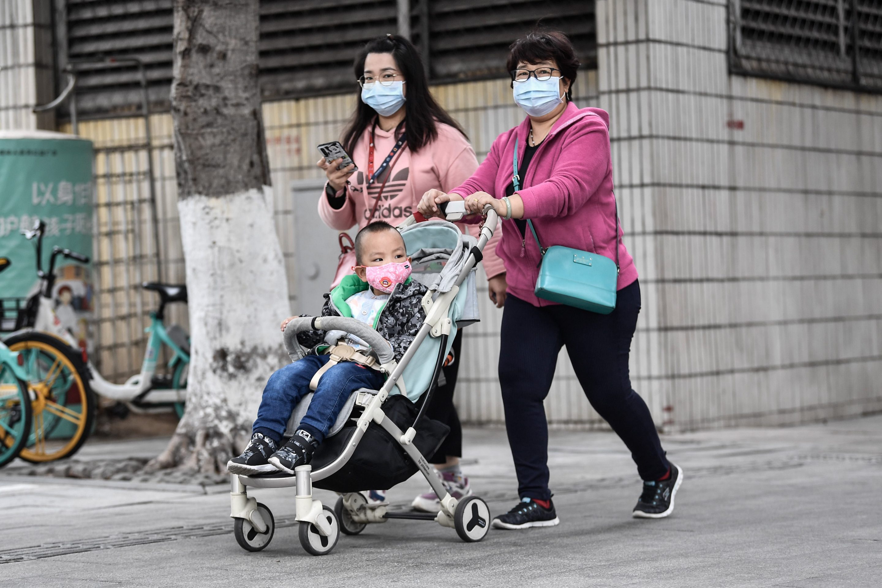 GUAGZHOU, CHINA - JANUARY 22: Citizens wear masks to defend against new viruses on January 22,2020 in Guangzhou, China.The 2019 new coronavirus, known as "2019-nCoV", was discovered in Wuhan virus pneumonia cases in 2019, and the virus was transmitted from person to person. Currently, confirmed cases have been received in various parts of the world. (Photo by Stringer/Anadolu Agency via Getty Images)
