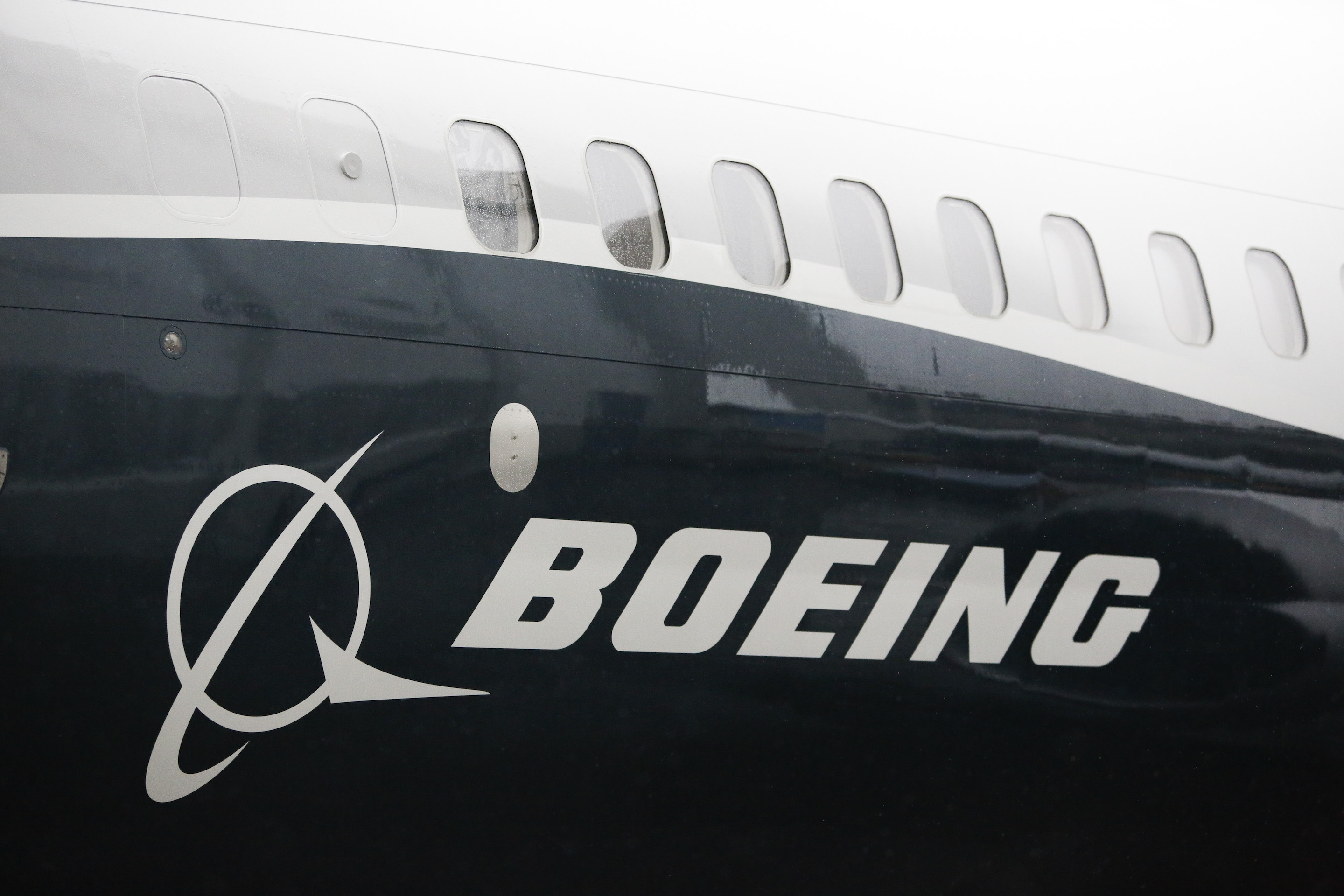 The Boeing logo on the first Boeing 737 MAX 9 airplane is pictured during its rollout for media at the Boeing factory in Renton, Washington on March 7, 2017. Boeing is expected to announce more than $10 billion in new charges resulting from the two 737 MAX crashes that killed 346 people, analysts tell Fortune. JASON REDMOND—AFP/Getty Images