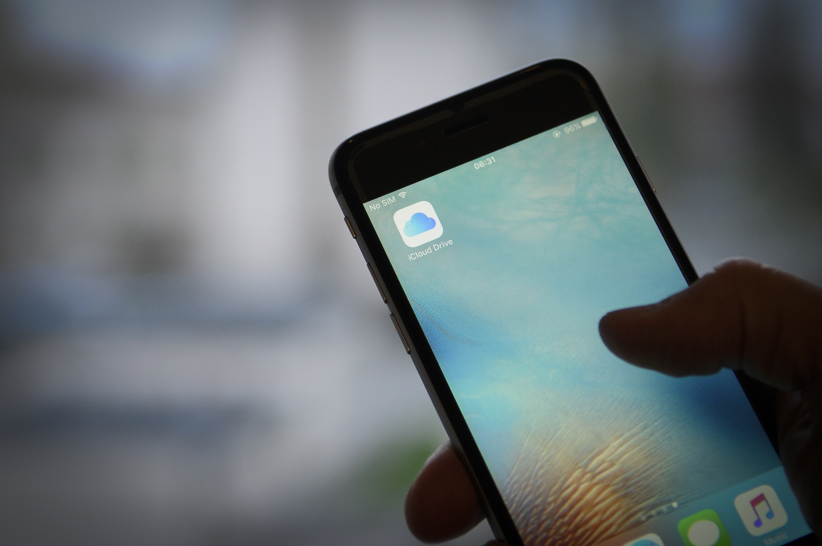 The iCloud storage application is seen on an iPhone on November 8, 2017. This week's biggest Apple headlines say it scrapped plans to allow encrypted iCloud backups, and a new, low-cost iPhone is reportedly in production. Photo by Jaap Arriens/NurPhoto