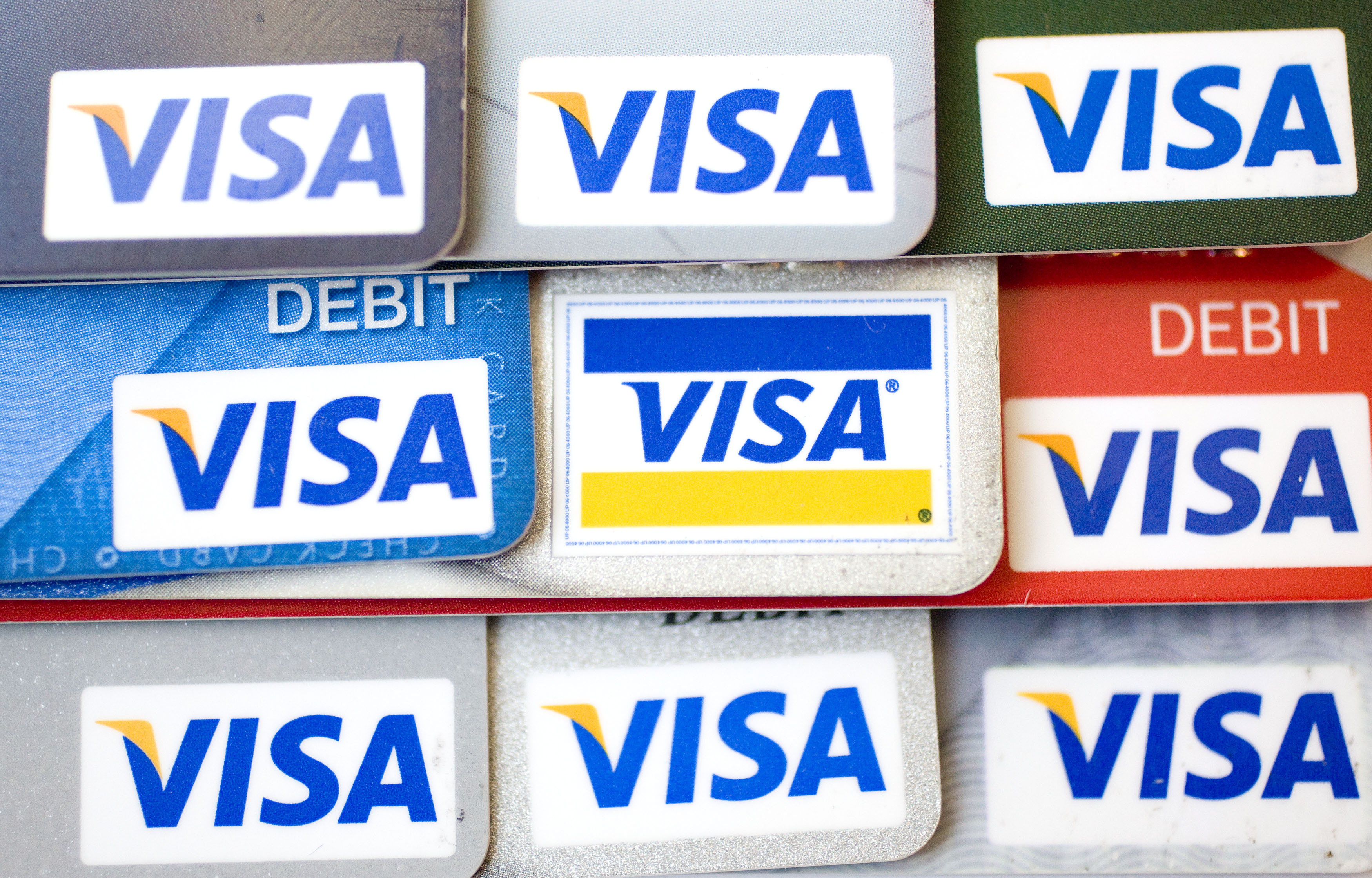 Visa logos appear on credit and debit cards