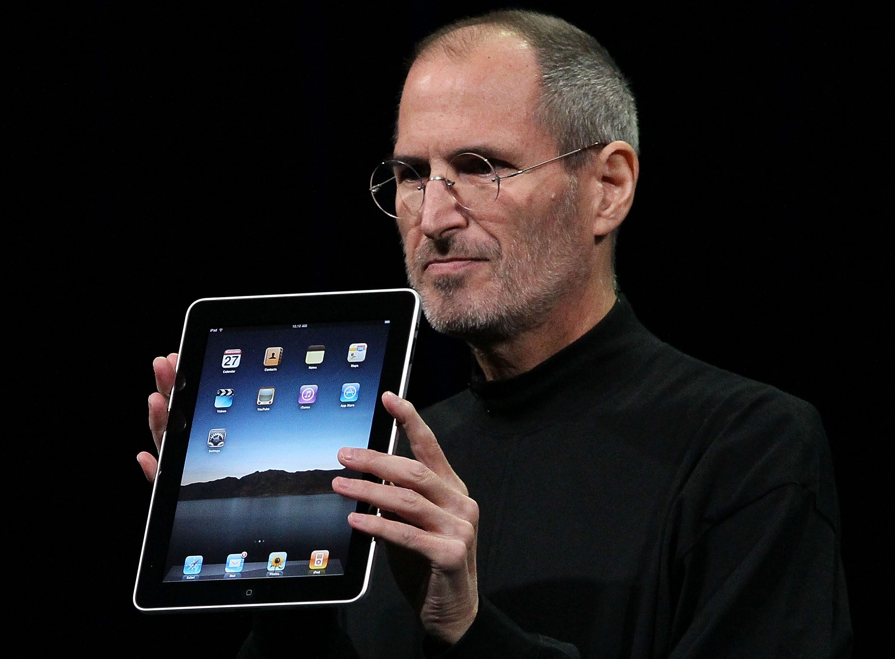 Steve Jobs holds up the new iPad as he speaks during an Apple Special Event at Yerba Buena Center for the Arts January 27, 2010 in San Francisco, California. Photo by Justin Sullivan/Getty Images