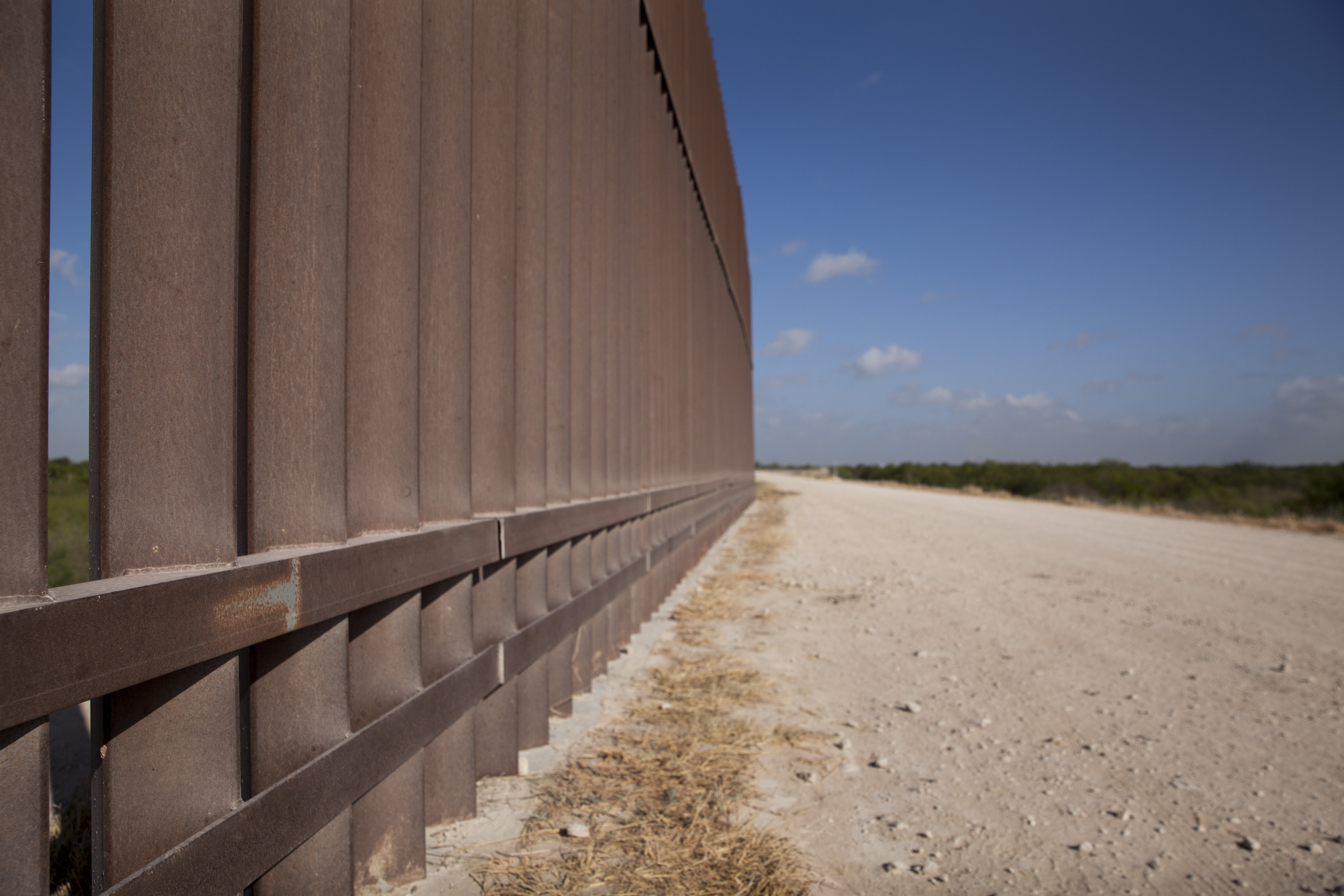 A section of the border wall stretches through the Rio Grande Valley sector of the Texas border on Aug. 20, 2019.