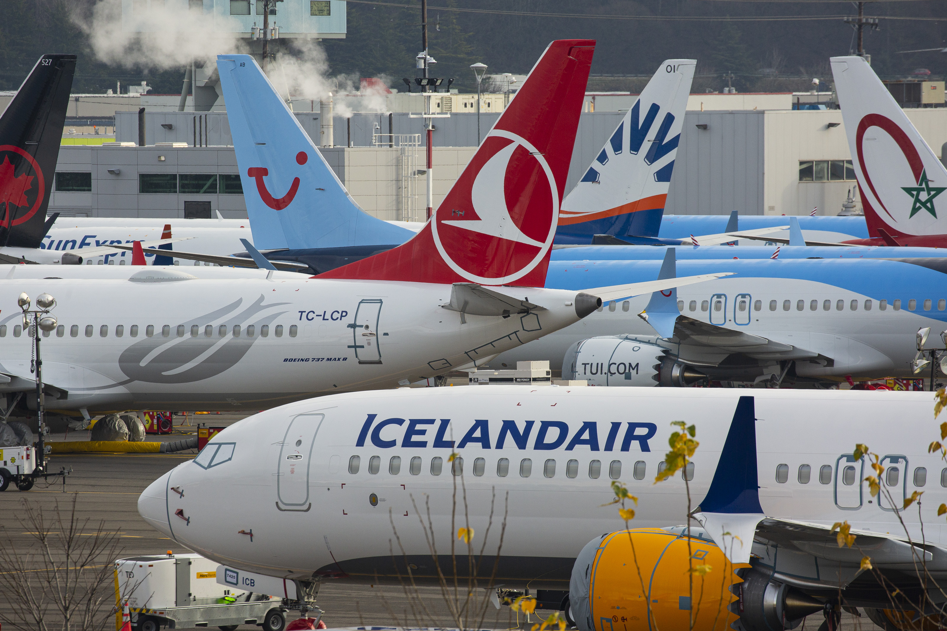 Grounded Boeing Co. 737 Max airplanes are seen in a parking lot near Boeing Field in Seattle, Washington, U.S., on Tuesday, Dec. 17, 2019. Boeing plans to halt production of its grounded 737 Max in January, a move that will deepen the crisis engulfing the planemaker, complicate its eventual recovery and ripple through the U.S. economy. Photographer: David Ryder/Bloomberg via Getty Images