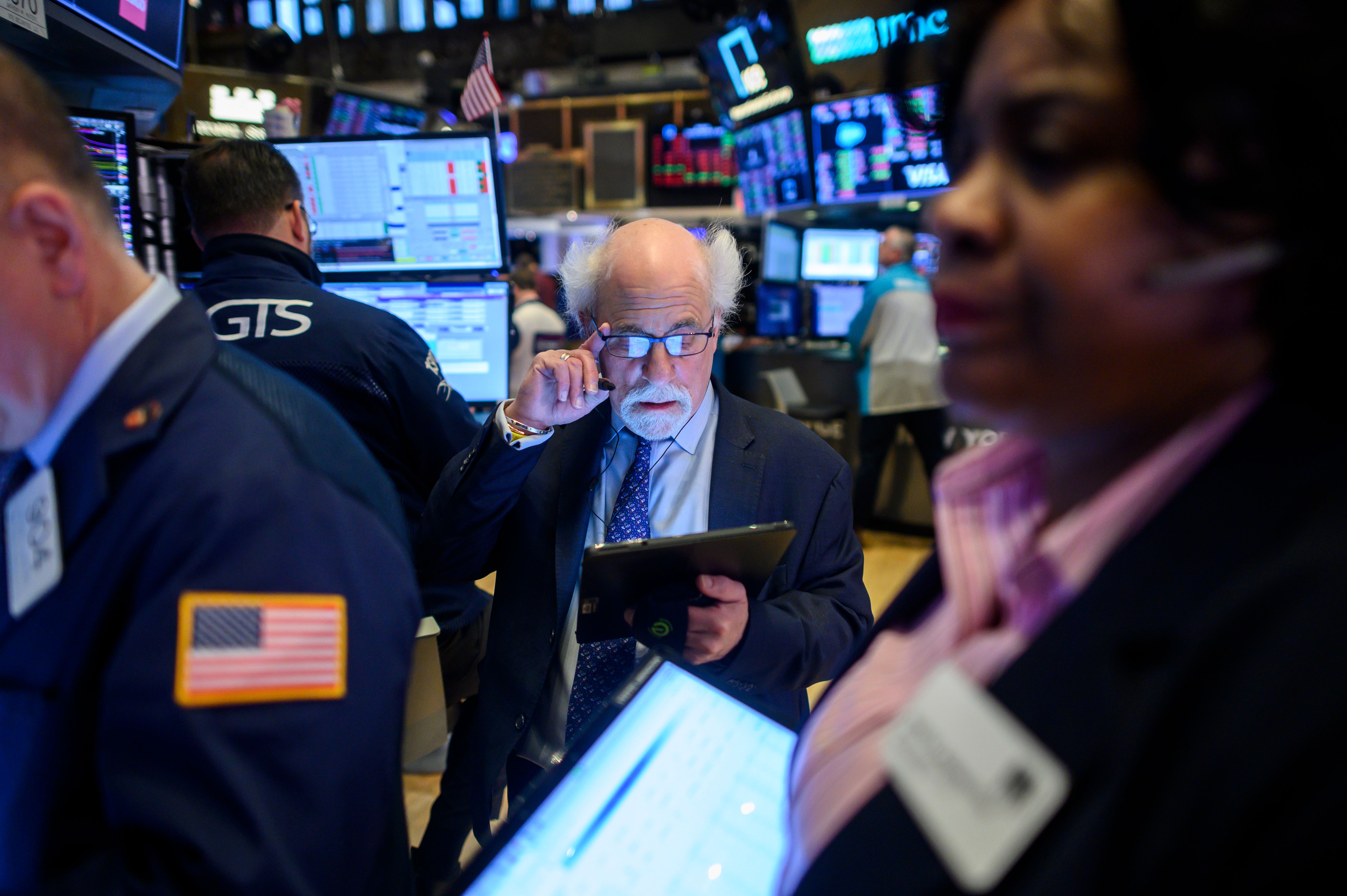 Traders work during the opening bell at the New York Stock Exchange (NYSE) on February 27, 2020 at Wall Street in New York City. - Wall Street stocks opened sharply lower Thursday, joining a sell-off in most global bourses on fears the coronavirus will grow into a significant international health crisis.
About five minutes into trading, the Dow Jones Industrial Average was down 1.8 percent, or about 480 points. The blue-chip index has fallen the last five days. (Photo by Johannes EISELE / AFP) (Photo by JOHANNES EISELE/AFP via Getty Images)