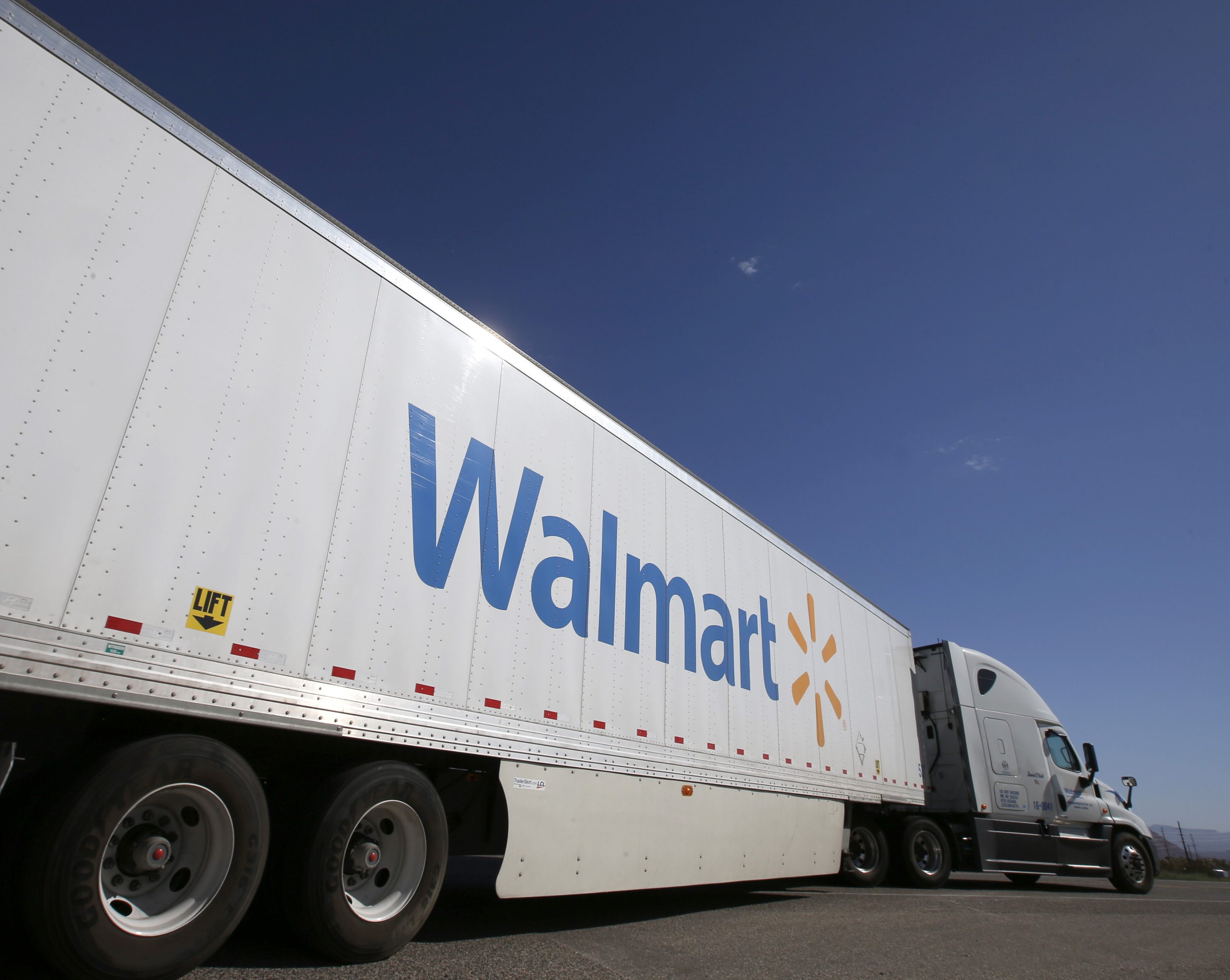 A Wal-Mart Stores Inc. tractor trailer truck departs the company's distribution center in Washington, Utah, U.S., on Friday, Sept. 23, 2016. The International Council of Shopping Centers is scheduled to release U.S. chain store sales figures on October 6. 