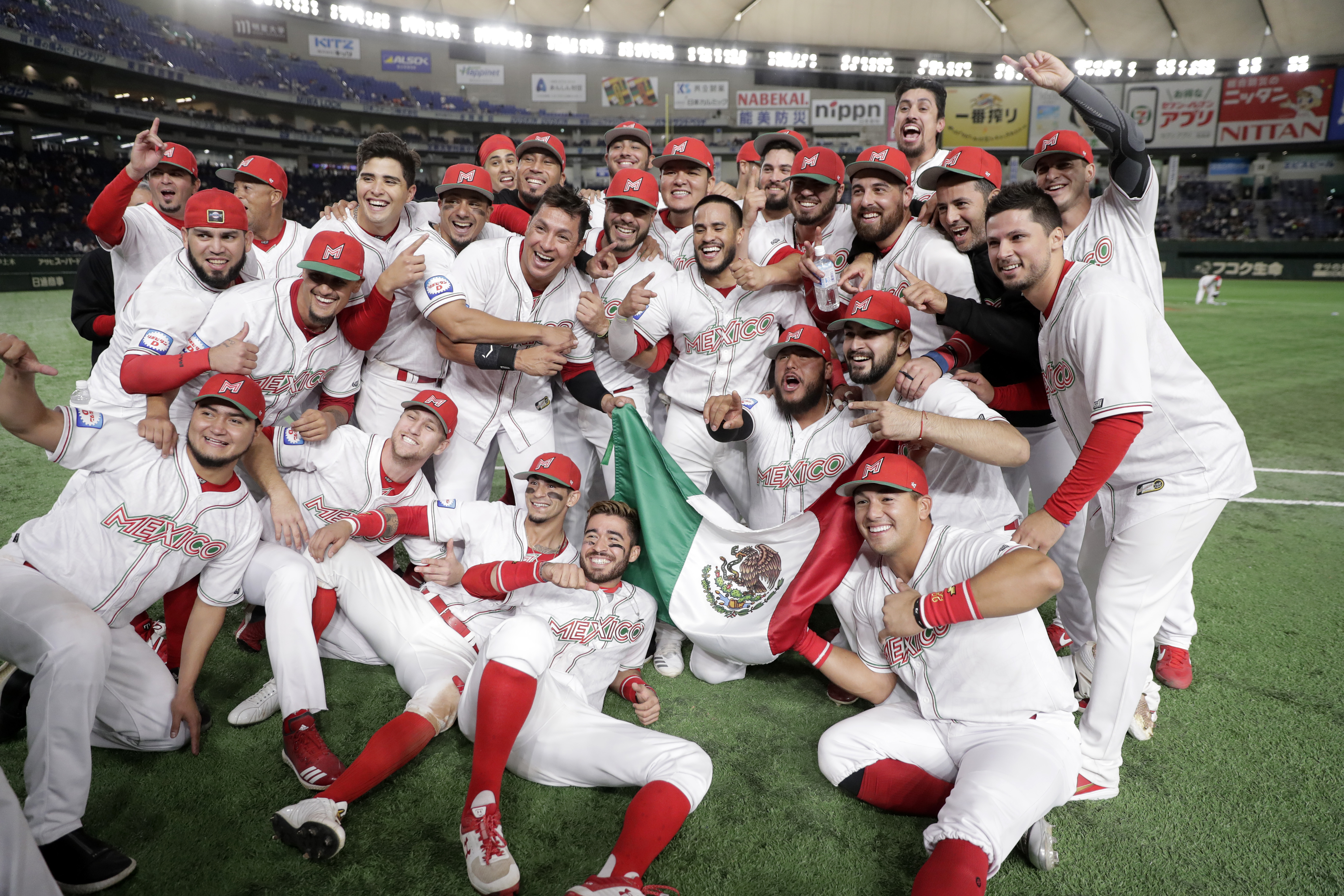 TOKYO, JAPAN - NOVEMBER 17: Mexico players celebrate their victory and qualification for the Tokyo 2020 Olympic Games after the WBSC Premier 12 Bronze Medal final game between Mexico and USA at the Tokyo Dome on November 17, 2019 in Tokyo, Japan. (Photo by Kiyoshi Ota/Getty Images)