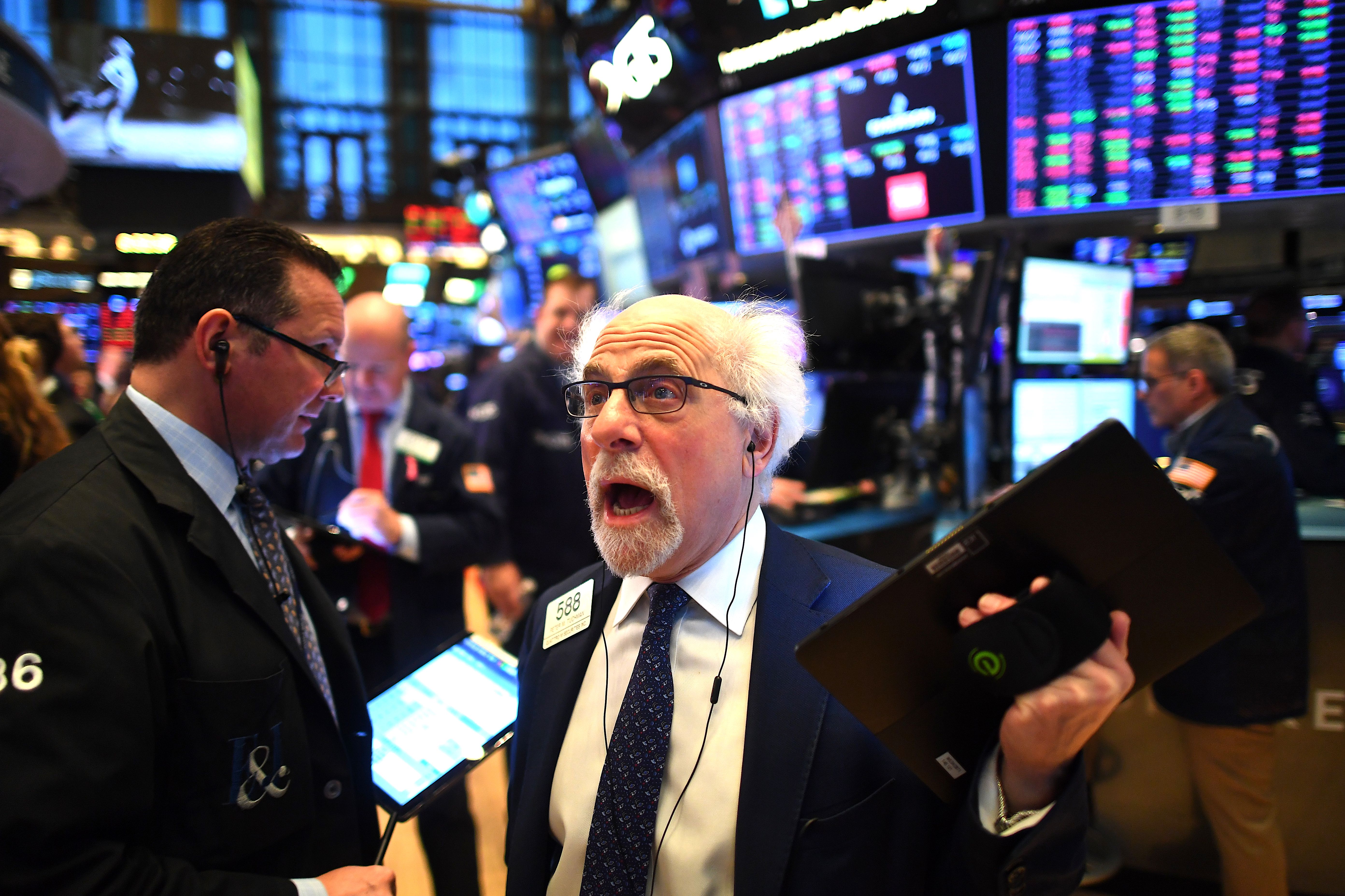 Traders work during the opening bell at the New York Stock Exchange (NYSE) on March 5, 2020 at Wall Street in New York City. - Wall Street stocks tumbled again in opening trading Thursday on fears of a global slowdown due to the coronavirus, extending the run of volatility that has dominated markets in recent weeks.About 20 minutes into trading, the benchmark Dow Jones Industrial Average was down 2.8 percent, or more 750 points, at 26,324.68. The index surged nearly 1,200 points on Wednesday. (Photo by Johannes EISELE / AFP) (Photo by JOHANNES EISELE/AFP via Getty Images)