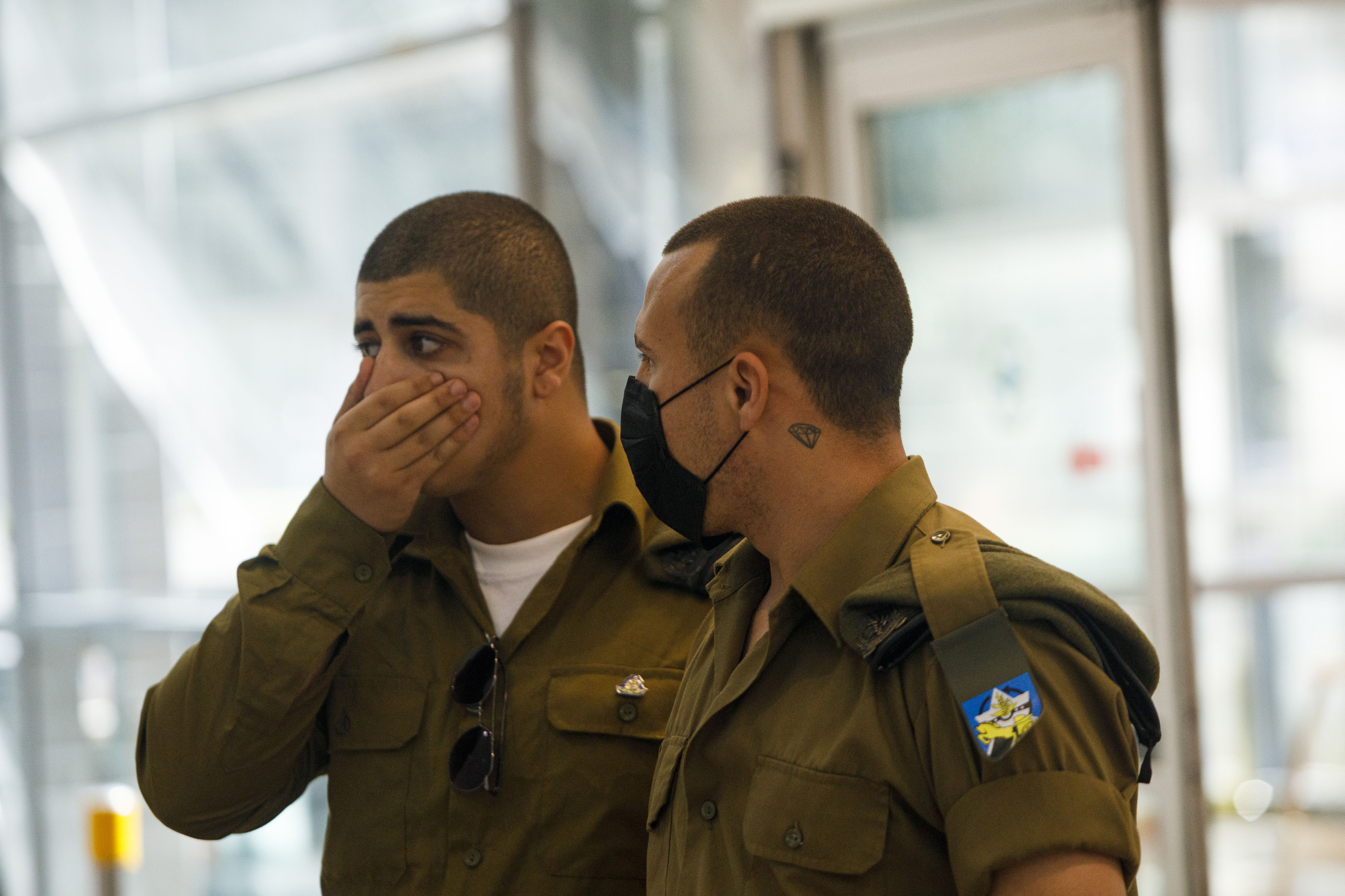 An Israeli soldier wears a black protective face mask as he monitors the arrivals hall at Ben Gurion International airport in Tel Aviv, Israel, on Tuesday, March 10, 2020. Israel expanded its 14-day quarantine policy to include arrivals from all countries, ramping up its efforts to beat back the spread of the coronavirus. Photographer: Kobi Wolf/Bloomberg via Getty Images