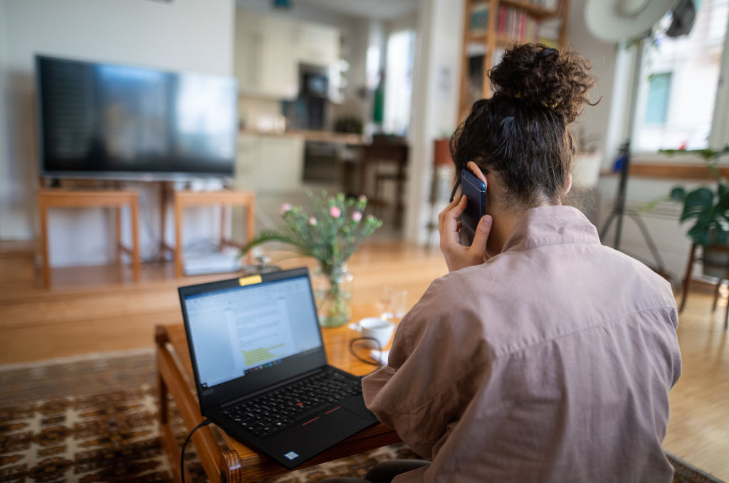 A woman participates in a conference call due to the spread of the coronavirus from her living room.
Stuttgart, Germany. March 18, 2020.