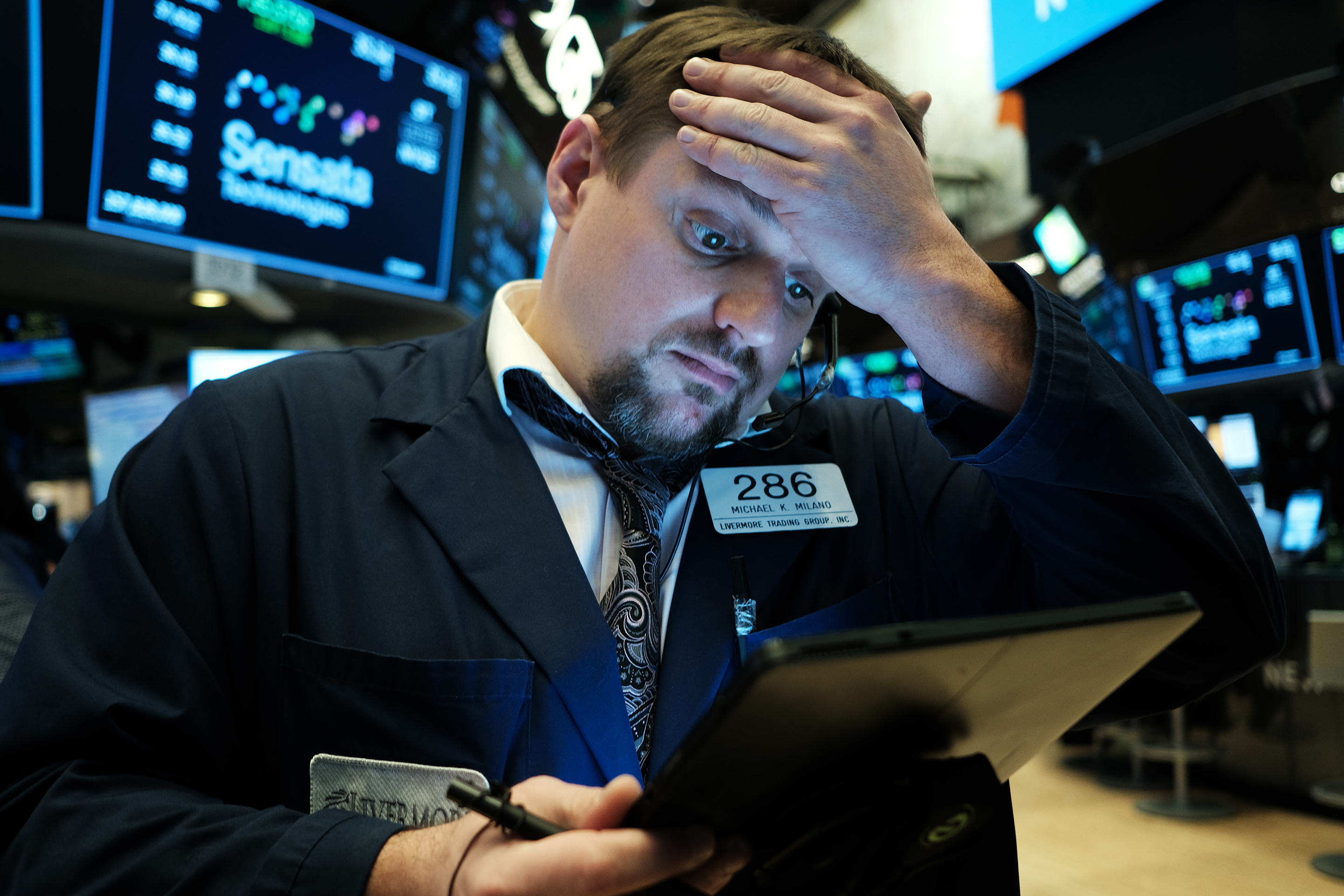 Traders work on the floor of the New York Stock Exchange (NYSE) on March 10, 2020 in New York City. After losing nearly 8 percent in a market rout yesterday, the Dow Jones Industrial Average was up over 700 points in morning trading as investors look to a possible tax cut and other measures by the Trump administration to combat the coronavirus. Photo by Spencer Platt—Getty Images