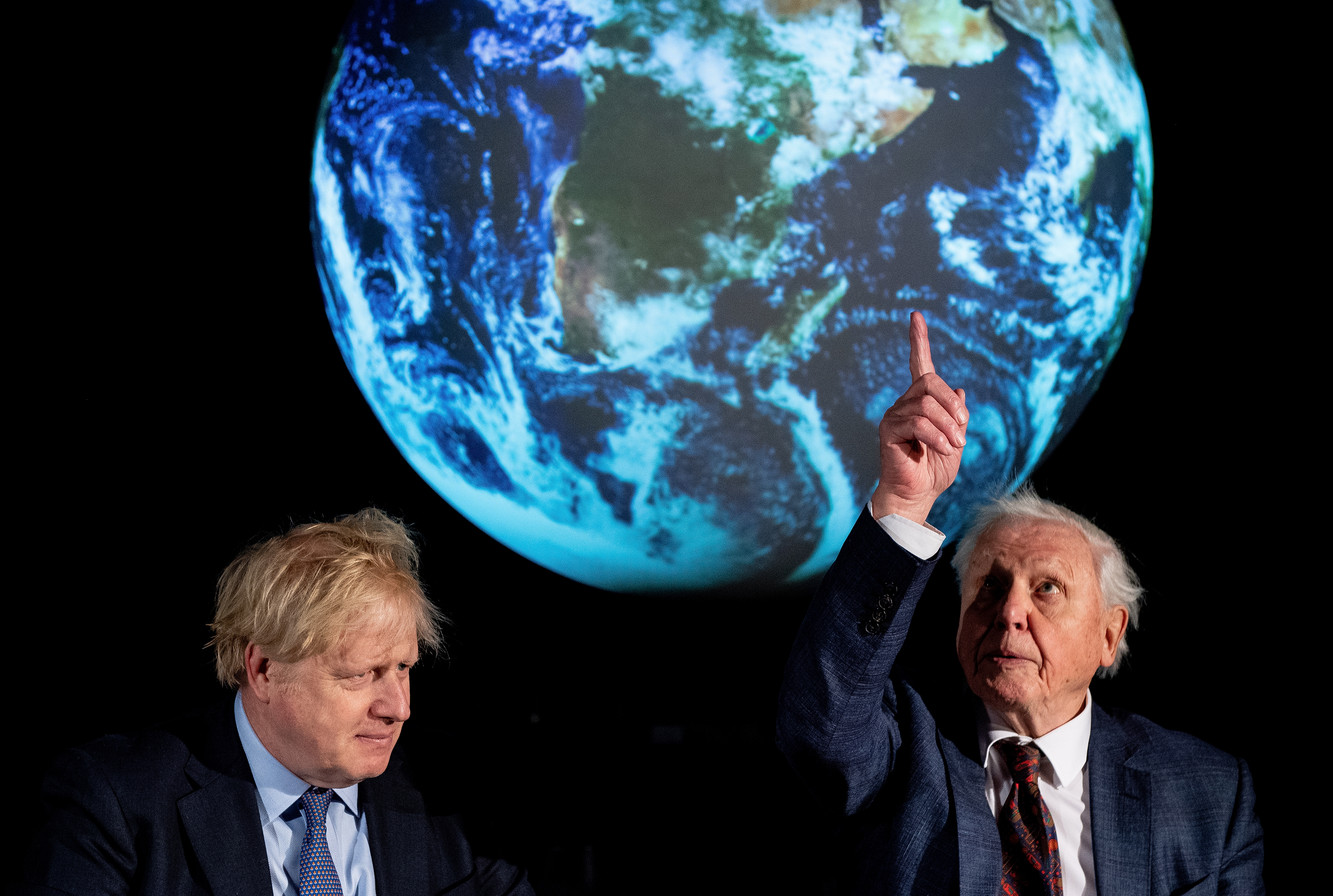 British Prime Minister Boris Johnson and naturalist Sir David Attenborough attended the launch of the now postponed UK-hosted COP26 UN Climate Summit (Photo by Chris J Ratcliffe-WPA Pool/Getty Images)