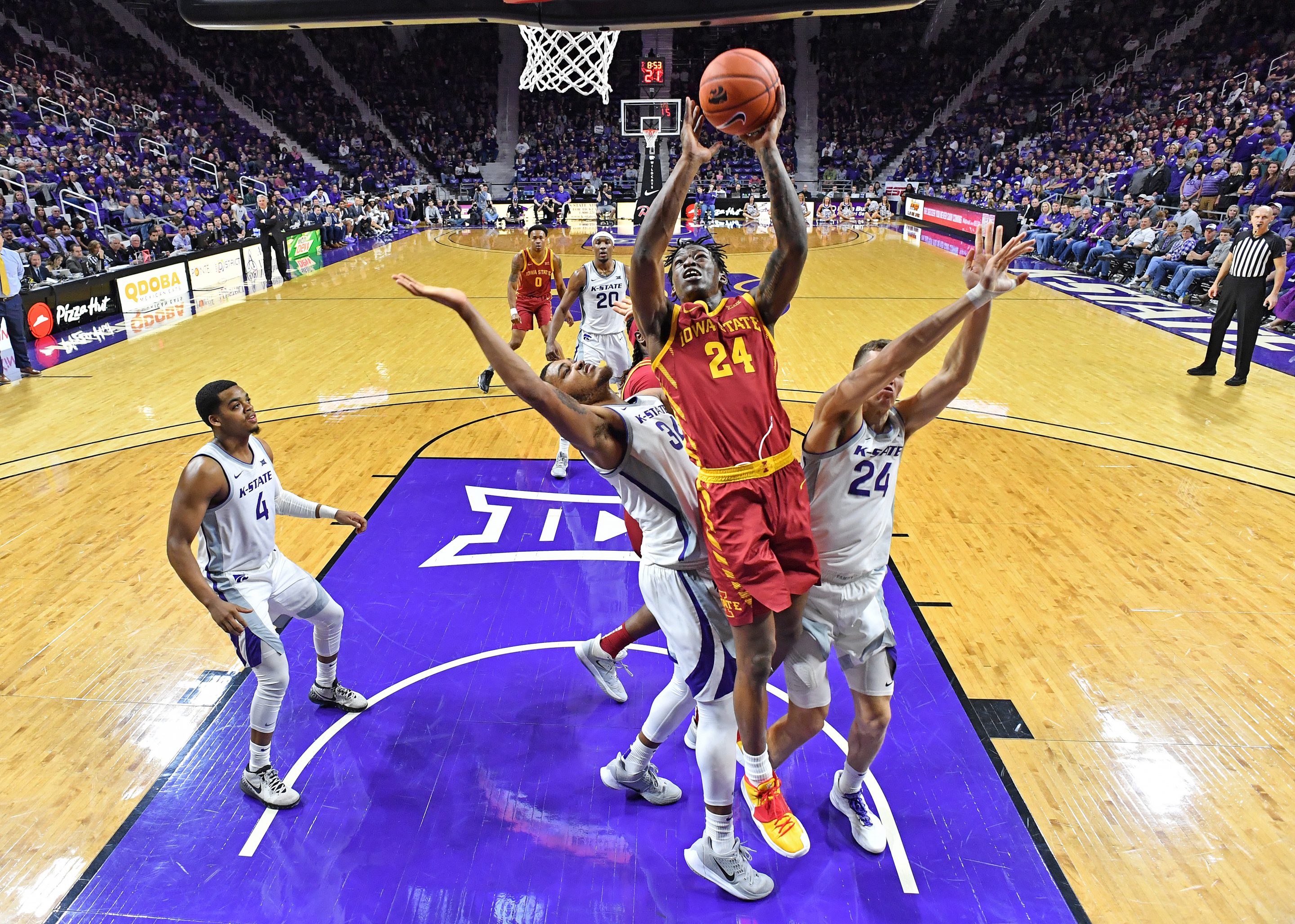 MANHATTAN, KS - MARCH 07: Terrence Lewis #24 of the Iowa State Cyclones drives to the basket between Levi Stockard III #34 and Pierson McAtee #24 of the Kansas State Wildcats during the second half at Bramlage Coliseum on March 7, 2020 in Manhattan, Kansas. (Photo by Peter G. Aiken/Getty Images)