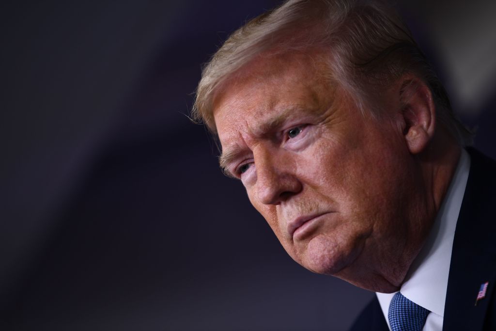 US President Donald Trump looks on during a press briefing at the White House in Washington, DC, on March 16, 2020. - The first human trial to evaluate a candidate vaccine against the new coronavirus has begun in Seattle, US health officials said, raising hopes in the global fight against the disease. (Photo by Brendan Smialowski / AFP) (Photo by BRENDAN SMIALOWSKI/AFP via Getty Images)