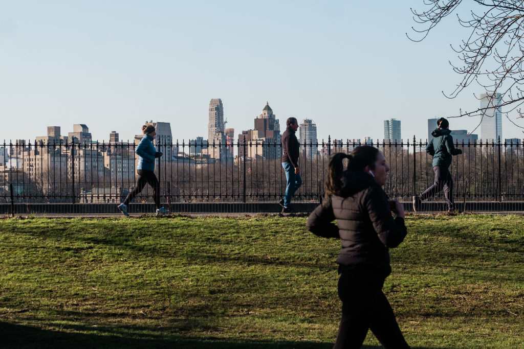 People jog through Central Park in New York, U.S., on Thursday, March 26, 2020. New York Governor Andrew Cuomo said that the restrictions on daily life in New York have slowed the increase in hospitalizations. Photographer: Gabriela Bhaskar/Bloomberg via Getty Images