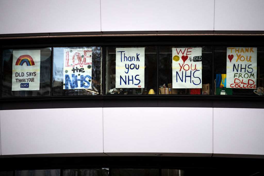 Posters in support of the NHS in the windows of a college opposite St Thomas' Hospital in London as the UK continues in lockdown to help curb the spread of the coronavirus. (Photo by Victoria Jones/PA Images via Getty Images)