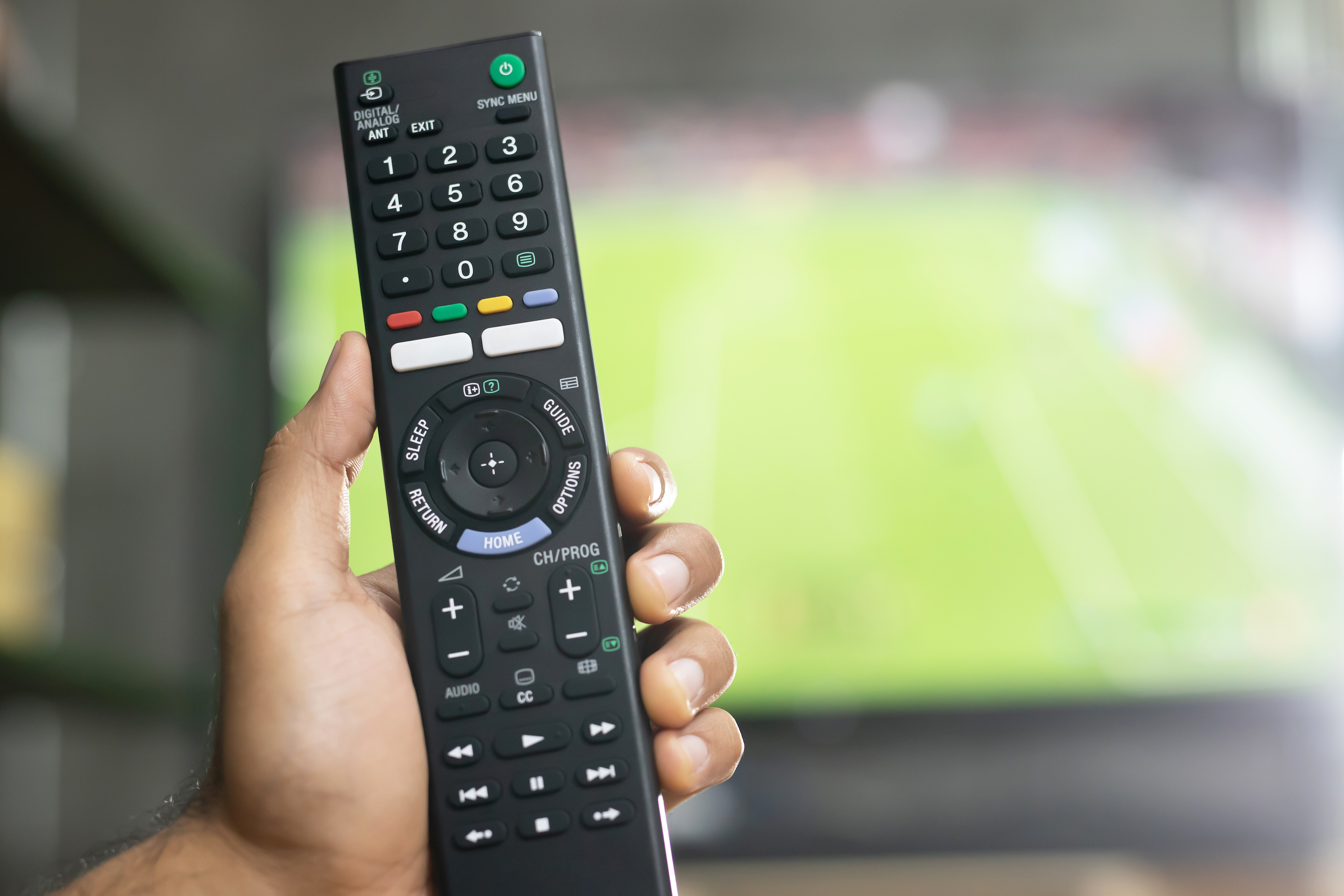 A man watches a live broadcast of the World Cup.