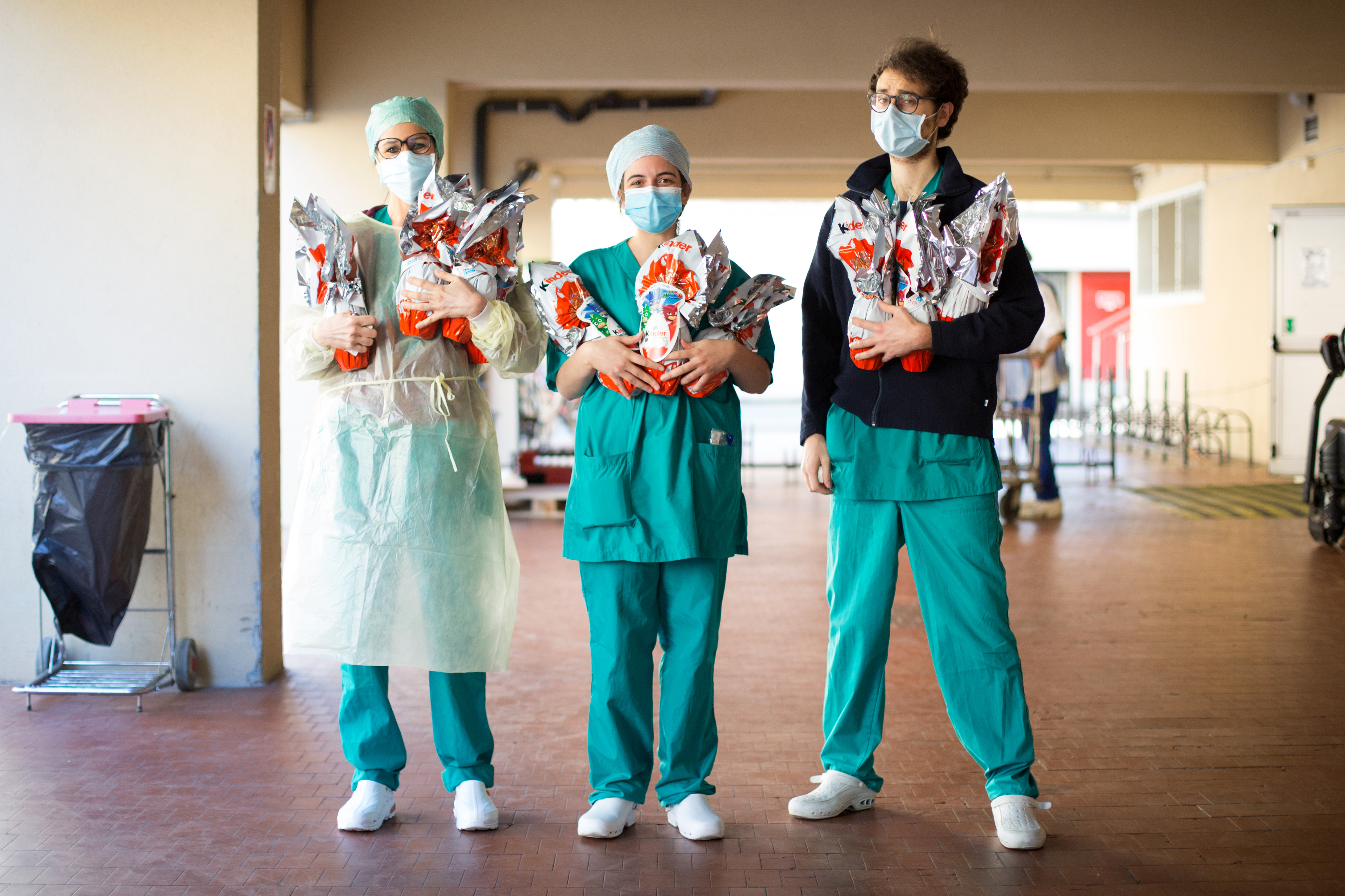 Sant'Orsola Hospital's team, in partnership with Ferrero, pose as they are about to distribute chocolate eggs for Easter to all employees including doctors, nurses and medical guards on April 10, 2020 in Bologna, Italy. (Photo by Massimo Cavallari/Getty Images)
