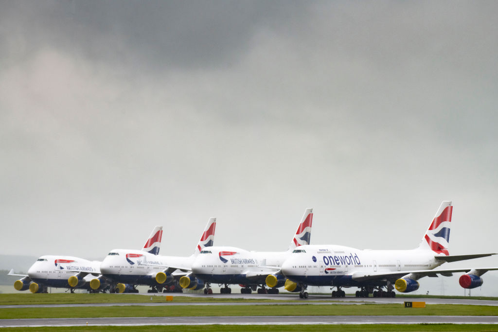 CARDIFF, UNITED KINGDOM - APRIL 28: British Airways branded aircraft grounded at Cardiff Airport on April 28, 2020 in Cardiff, United Kingdom. British Airways has announced plans to make 12,000 workers redundant. The airline's owner International Airline Group (IAG) announced the cuts as it revealed revenue plunged 13% in the first quarter of 2020. British Prime Minister Boris Johnson, who returned to Downing Street this week after recovering from Covid-19, said the country needed to continue its lockdown measures to avoid a second spike in infections. (Photo by Matthew Horwood/Getty Images)