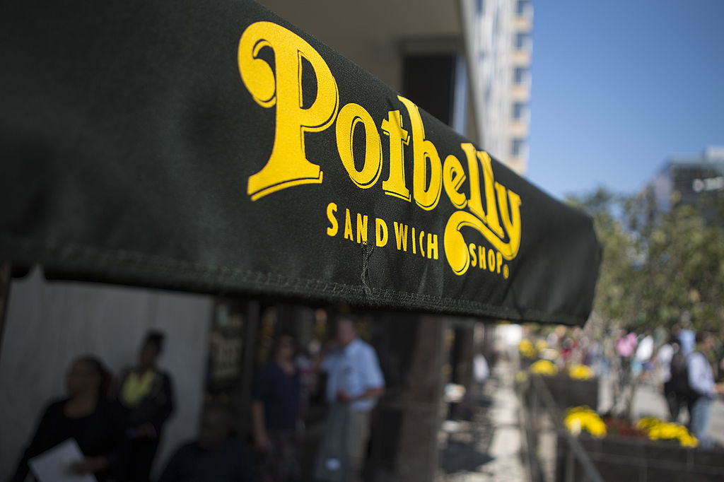 A Potbelly Corp. umbrella stands outside a sandwich shop location in Washington, D.C., U.S., on Friday, Oct. 4, 2013. Potbelly Corp., the Chicago-based purveyor of made-to-order toasted sandwiches, more than doubled in trading after pricing its IPO above an increased range. Photographer: Andrew Harrer/Bloomberg via Getty Images