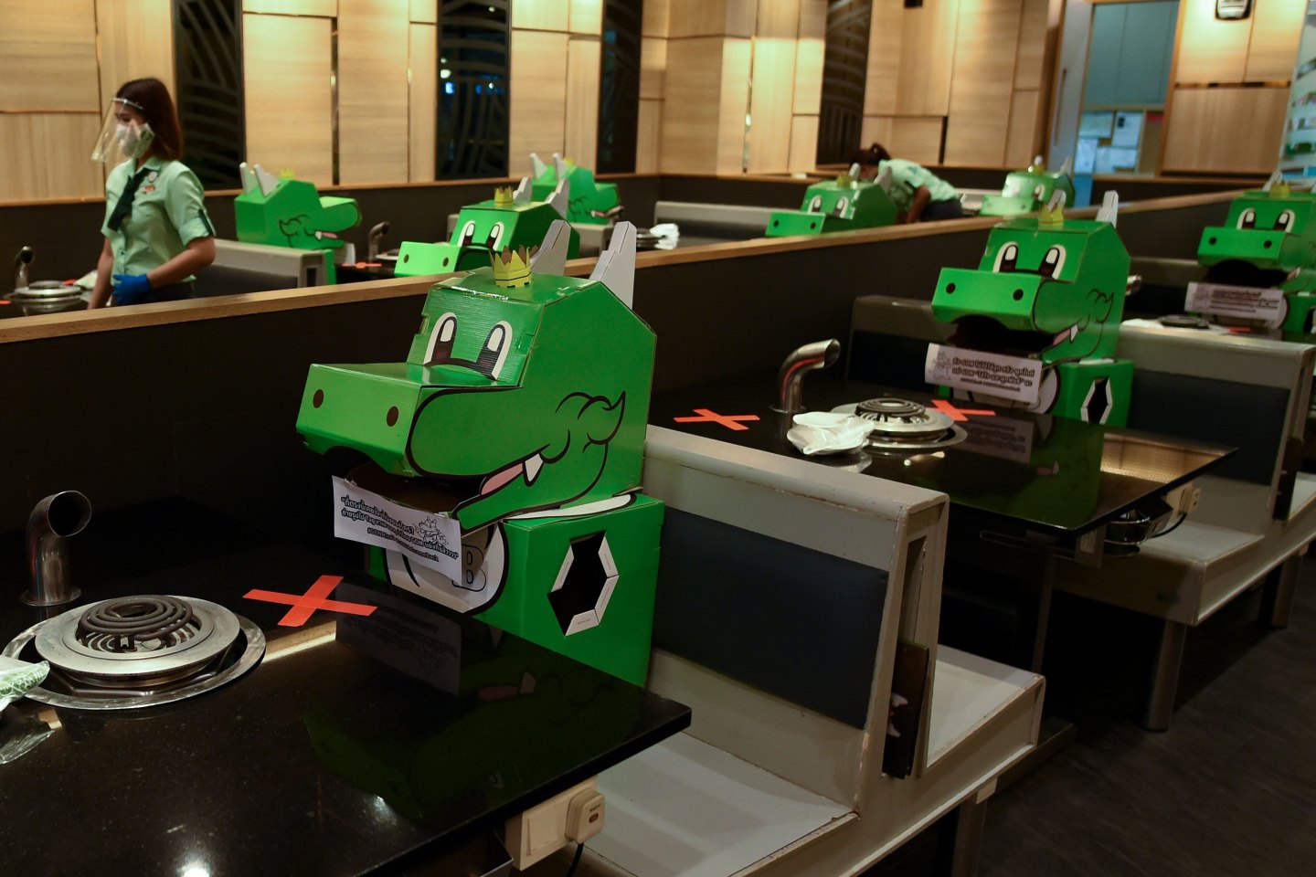 Social distance, party of one: Photos showing how the coronavirus is changing how we dine out