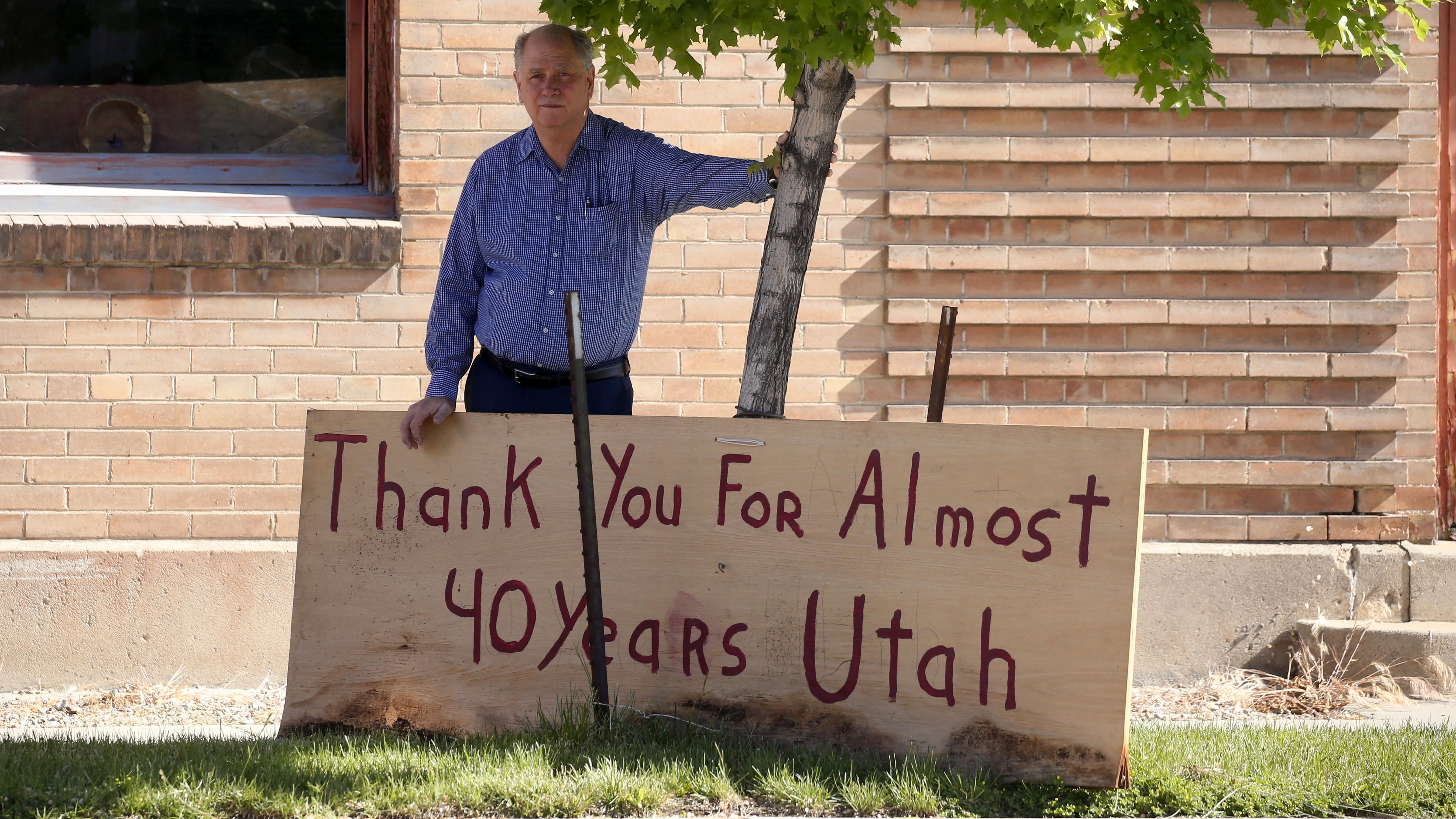 Euro Treasures Antiques owner Scott Evans poses next to a "thank You" sign on May 8, 2020, in Salt Lake City. Evans is closing his art and antique store after 40 years. Rick Bowmer—AP Photo