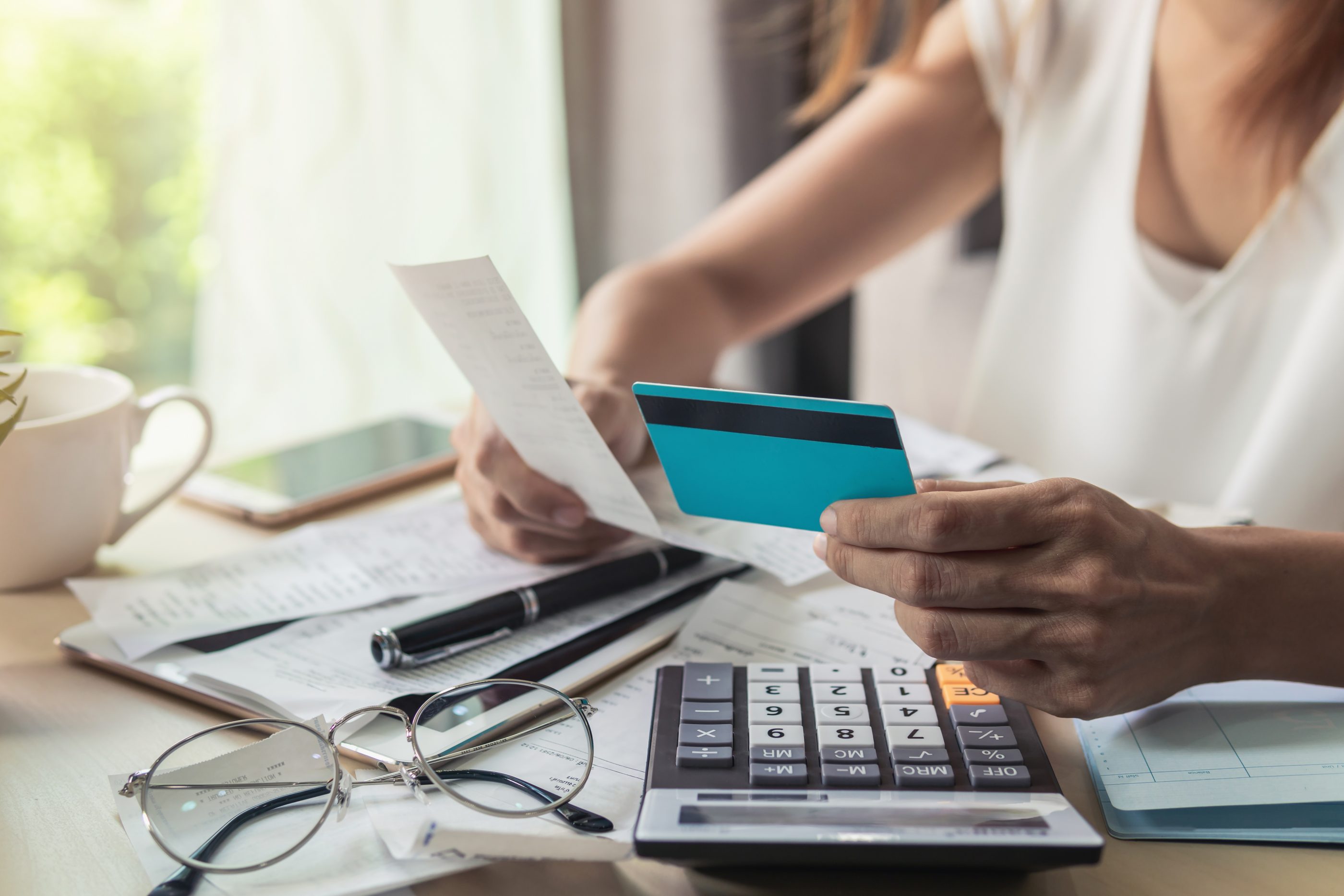 Despite historic unemployment and $14 trillion in outstanding consumer debt, government stimulus measures should keep defaults and delinquencies in check, say Goldman Sachs economists.