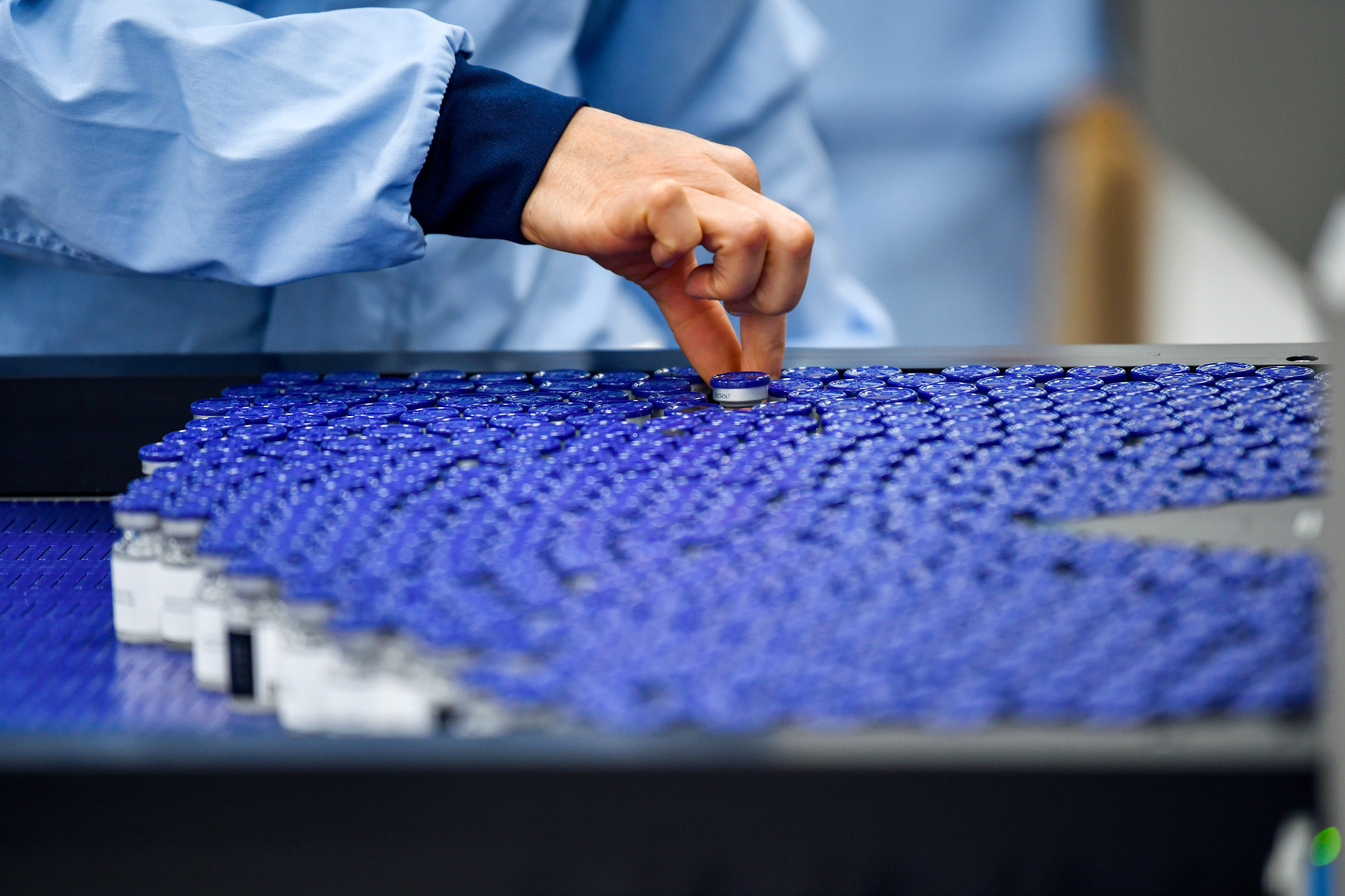 An operator picks out a vial on a production line at AstraZeneca Plc's new Biologics factory in Sodertalje, Sweden, on Thursday, April 11, 2019. AstraZeneca raised its annual sales forecast, helped by demand for the U.K. drugmaker's roster of new cancer drugs. Photographer: Mikael Sjoberg/Bloomberg via Getty Images