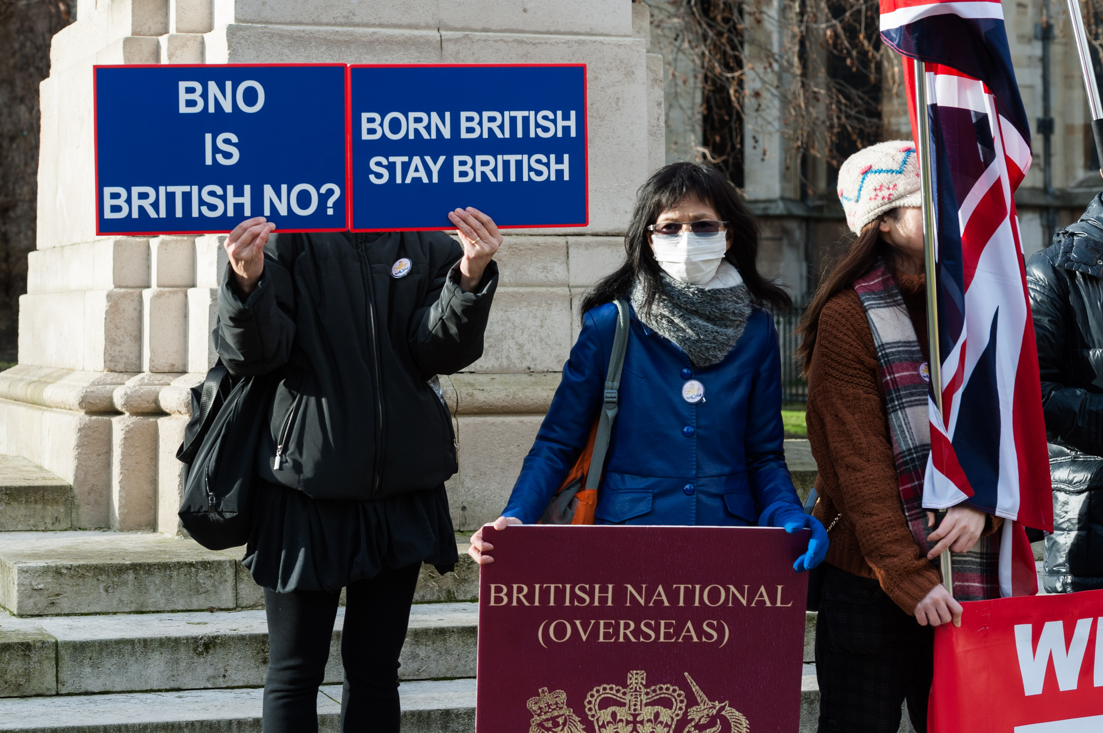 A group of Hong Kongers outside the Houses of Parliament in London protest the limited rights of British national overseas passport holders. (Wiktor Szymanowicz/Barcroft Media via Getty Images)