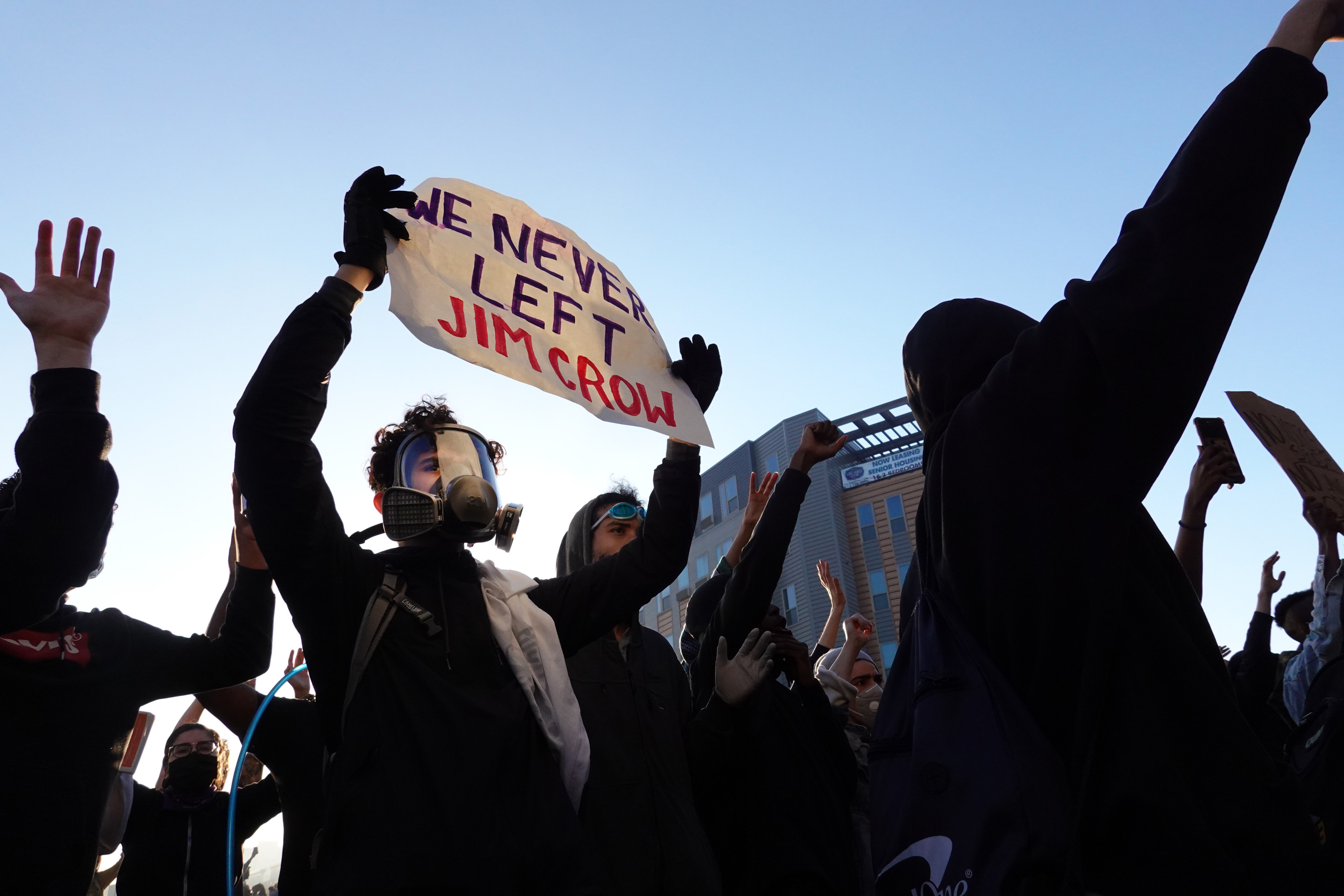 Demonstrators protest the death of George Floyd while he was in police custody on May 29, 2020 in Minneapolis, Minnesota. Former Minneapolis police officer Derek Chauvin was taken into custody for Floyd's death. Chauvin has been accused of kneeling on Floyd's neck as he pleaded with him about not being able to breathe. Floyd was pronounced dead a short while later. Chauvin and 3 other officers, who were involved in the arrest, were fired from the police department after a video of the arrest was circulated. (Photo by Scott Olson/Getty Images)