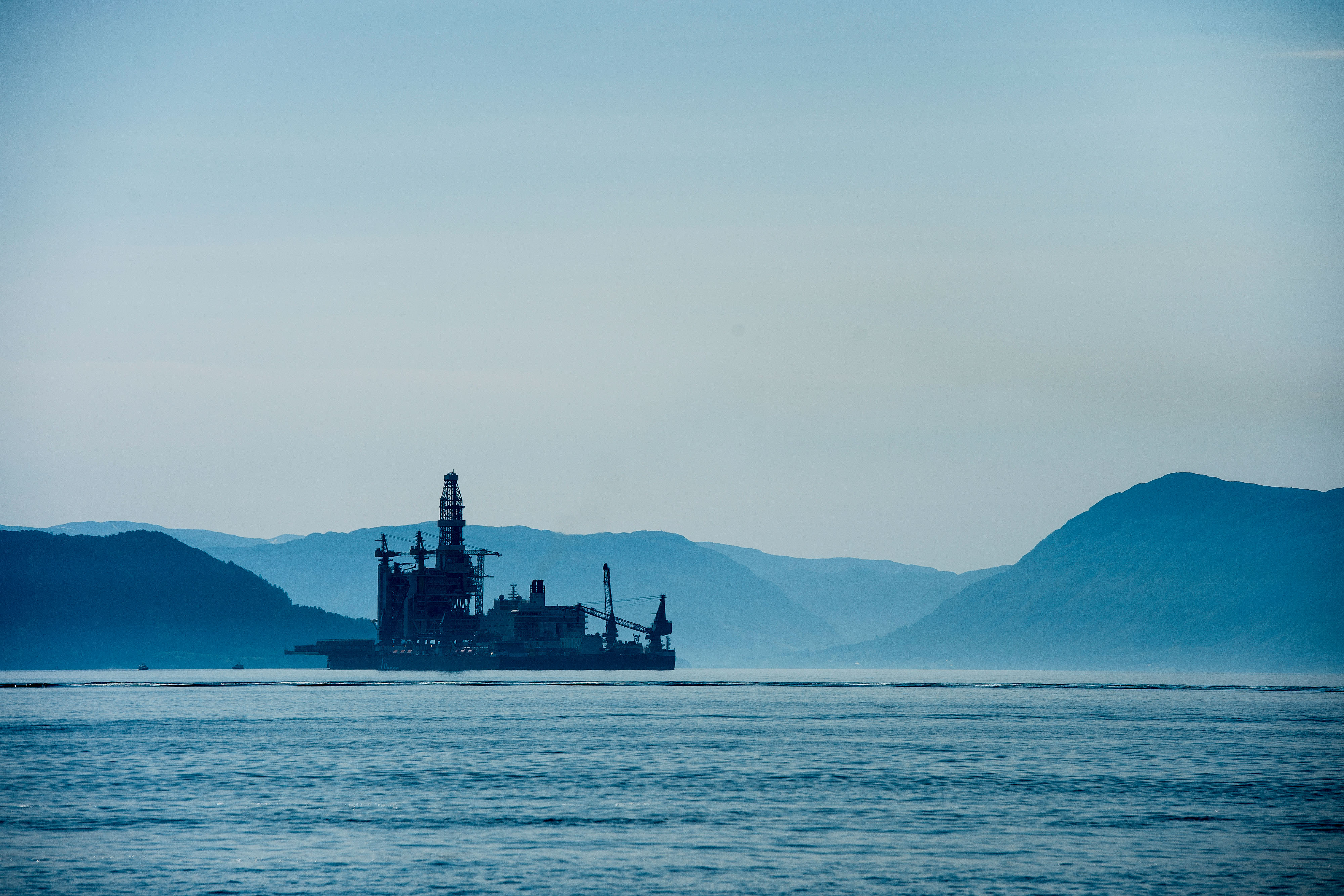 An oil drilling platform sits on board the world's largest construction vessel, the Pioneering Spirit, in the Bomla fjord near Leirvik, ahead of its transportation to the Johan Sverdrup oil field, Norway, on Friday, June 1, 2018. Equinor ASA has reduced the break-even price to below $20 a barrel in its flagship Johan Sverdrup oil project in the North Sea. Photographer: Carina Johansen/Bloomberg via Getty Images