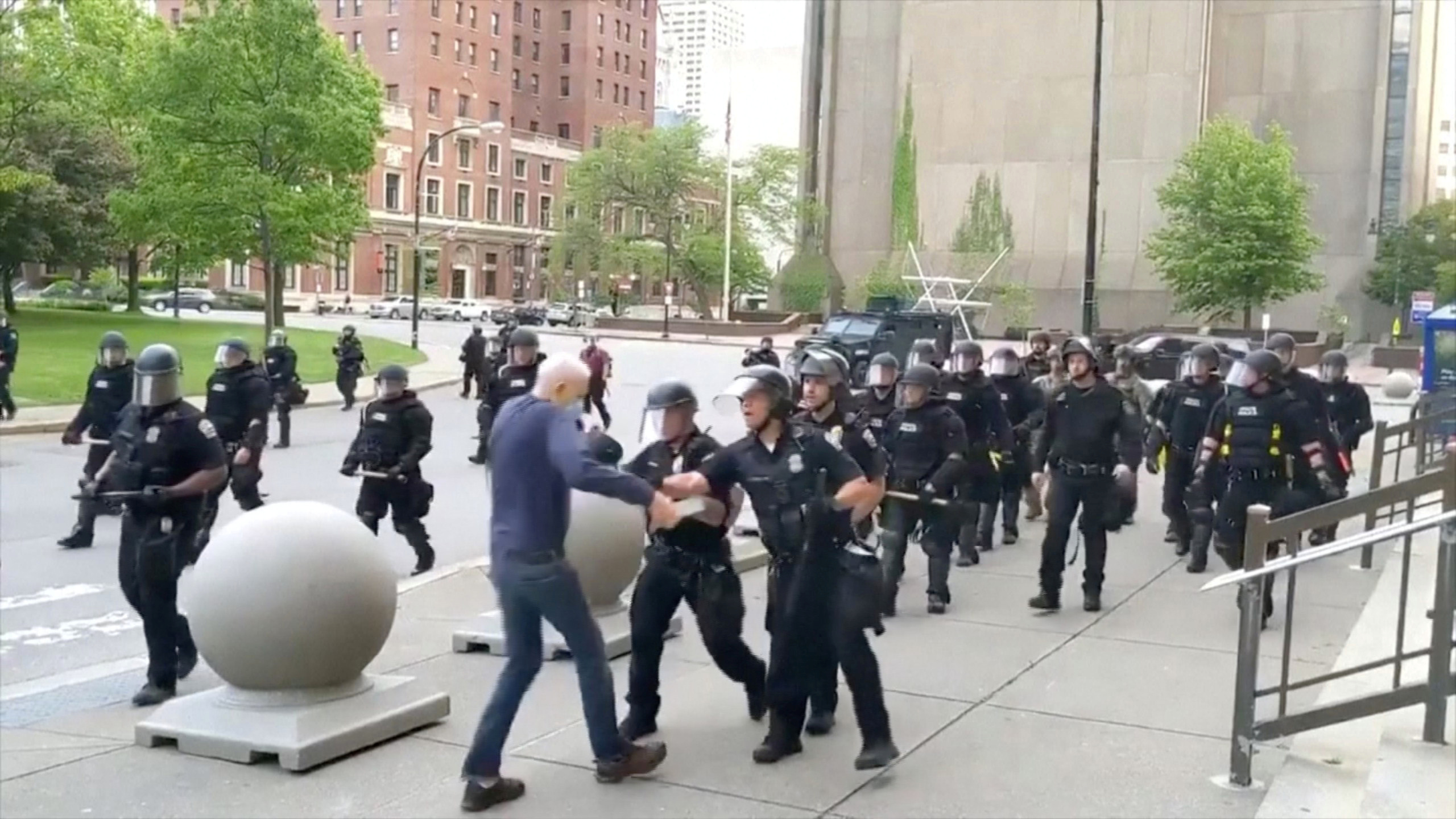 Ann elderly man ppears to be shoved by riot police during a protest against the death in Minneapolis police custody of George Floyd, in Buffalo, New York, U.S. June 4, 2020 in this still image taken from video. WBFO/via REUTERS TV