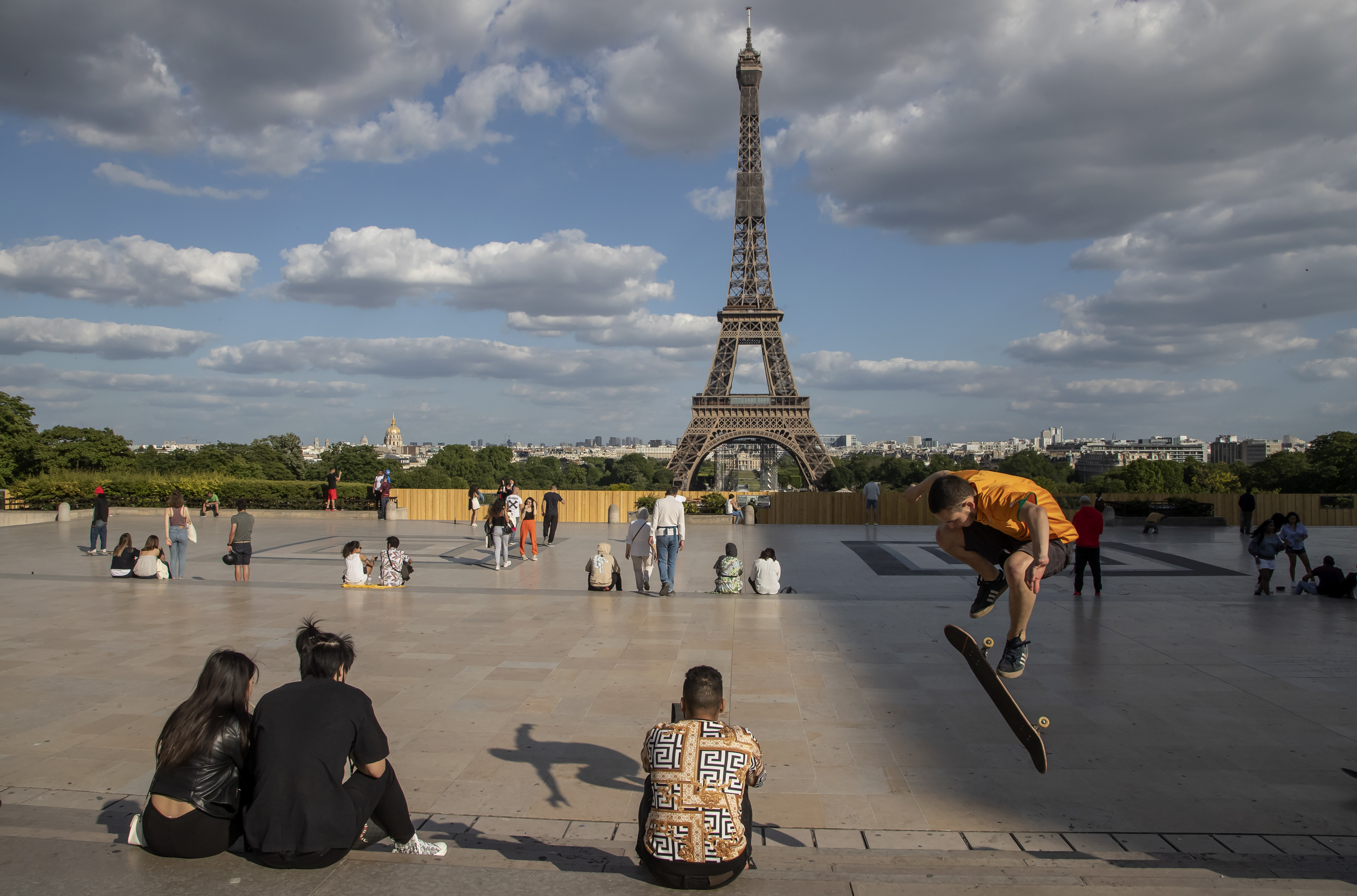 People stroll at Trocadero square near the Eiffel Tower in Paris, Monday, May 25, 2020, as France gradually lifts its Covid-19 lockdown. In Paris, where all city parks remain closed, residents stroll along the Seine river and outside the Tuileries Gardens.  Michel Euler—AP Photo