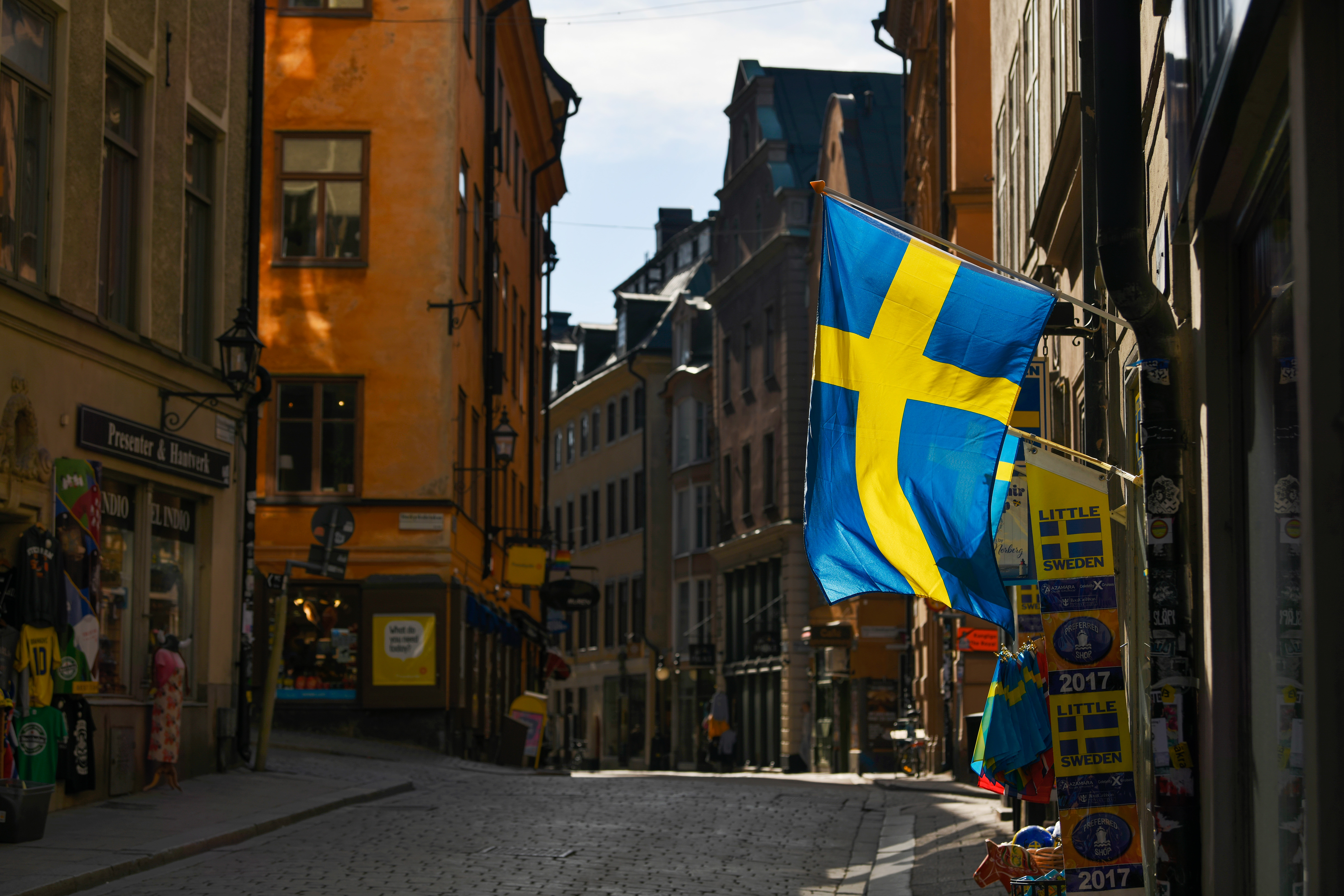 Swedish flags fly from a tourist souvenir shop in Gamla Stan in Stockholm, Sweden. The country's top epidemiologist acknowledged Sweden's controversial plan to achieve herd immunity in its fight against the coronavirus is taking longer than expected. Wire photography: Mikael Sjoberg—Bloomberg via Getty Images