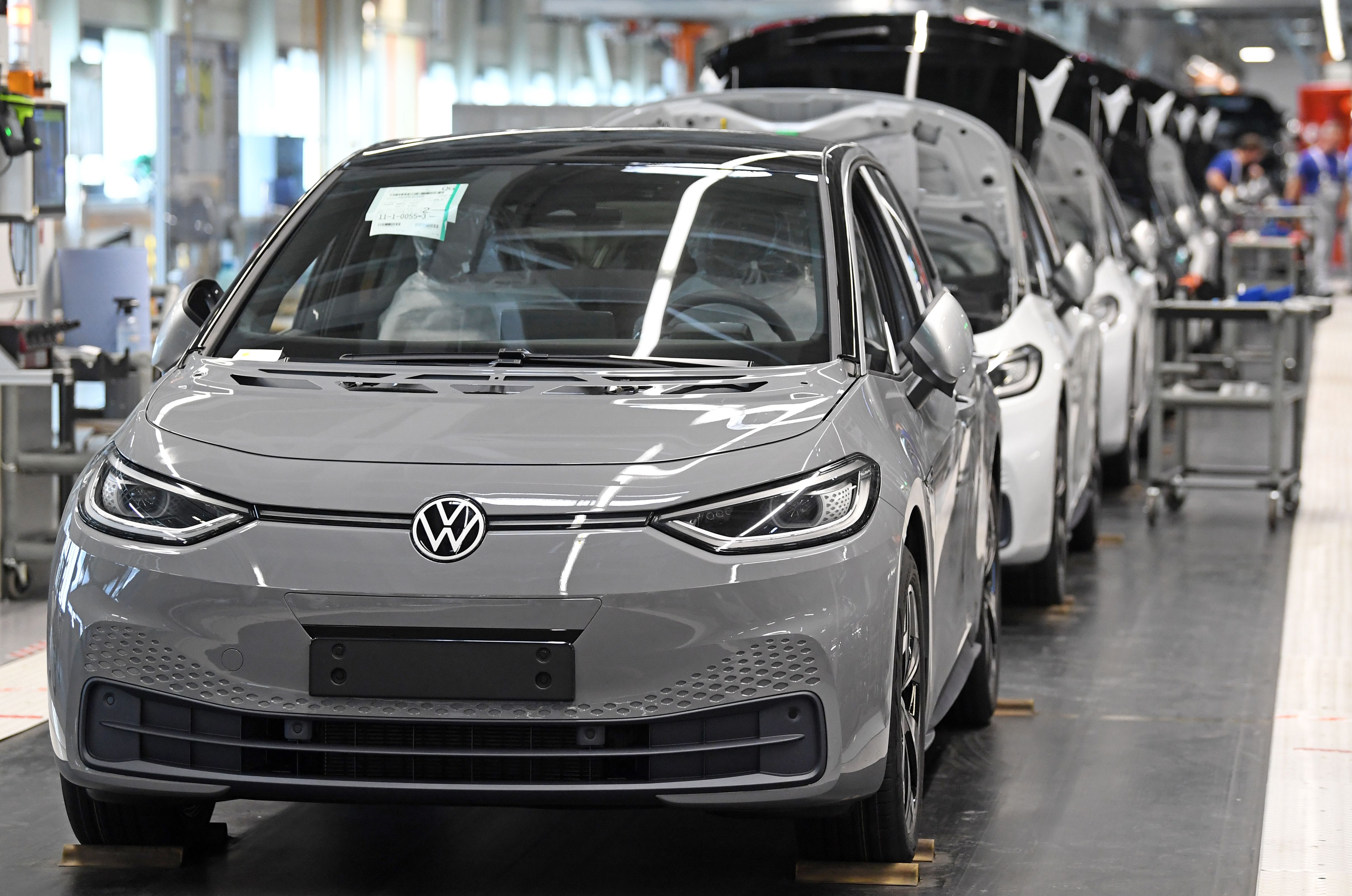 Almost finished Volkswagen ID.3 electric cars are seen at the end of the assembly line at the plant of German car maker Volkswagen (VW) in Zwickau, eastern Germany, after production restarted on April 23, 2020 amid the novel coronavirus COVID-19 pandemic.