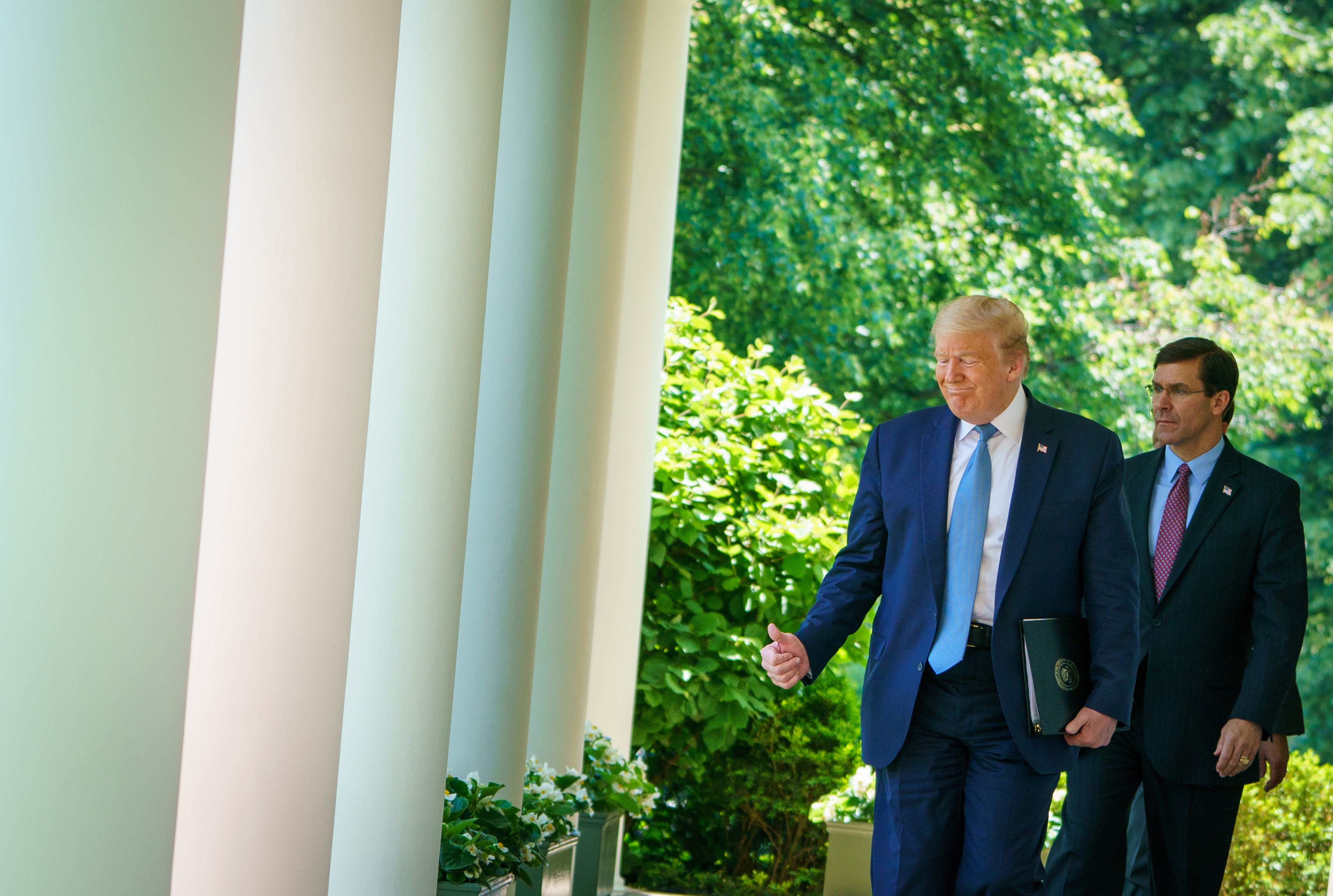 US President Donald Trump walks last month with Defense Secretary Mark Esper through the Colonnades at the White House. A new crisis is brewing between the president and Esper, plus his former defense secretary James Mattis over his handling of the protests over police violence and civil rights. Wire photography: Mandel Ngan—AFP via Getty Images