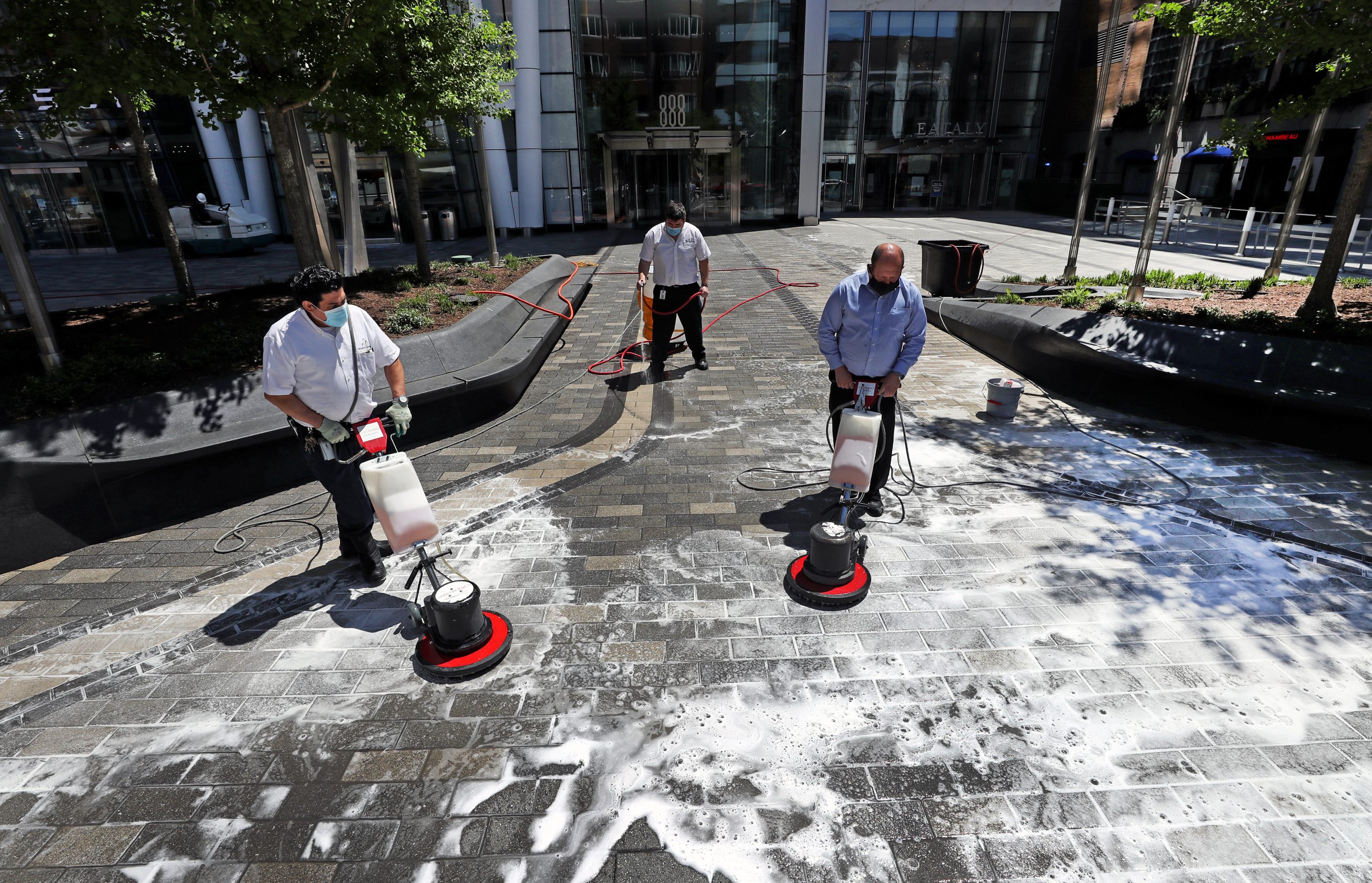 The walkway outside in front of the Prudential Center in Boston is soaped and washed.