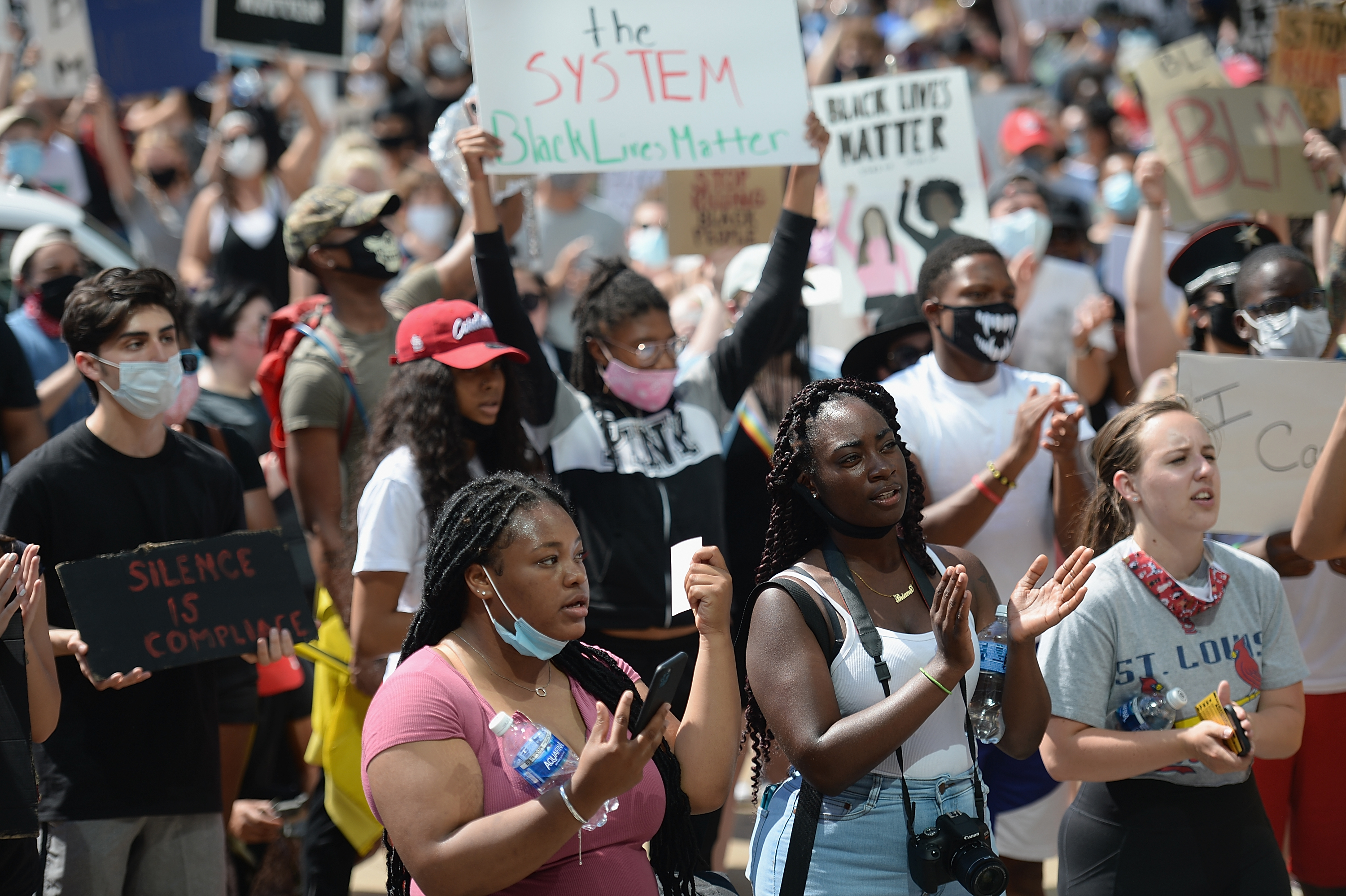 Protesters demonstrate against police brutality and the death of George Floyd outside the St. Louis City Justice Center and City Hall