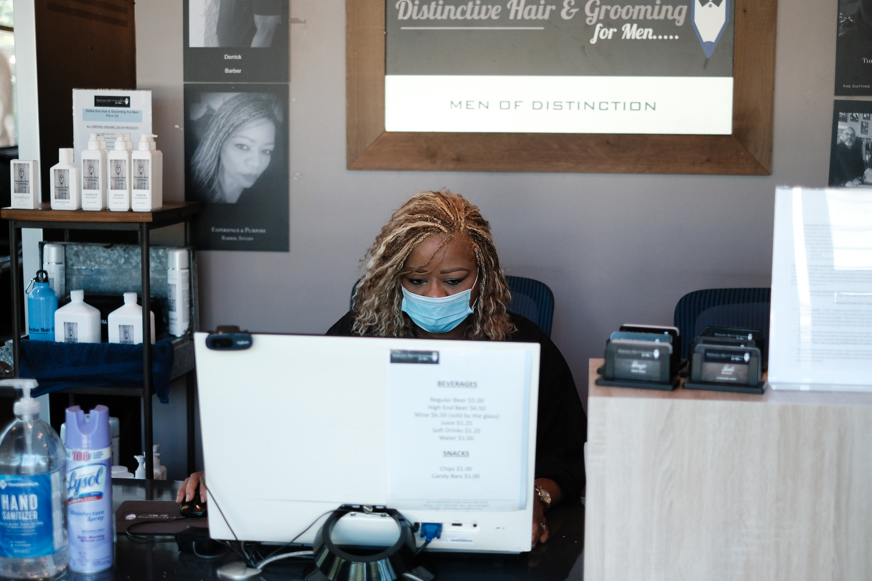 Deborah Gwynn performs administrative on the first day of the phase one reopening of Prince Georges County, at Distinctive Hair & Grooming for Men in Bowie, MD on June 1, 2020. Prince Georges County has lifted the stay-at-home order that was in place due to the COVID-19 pandemic. Michael A. McCoy—For The Washington Post via Getty Images