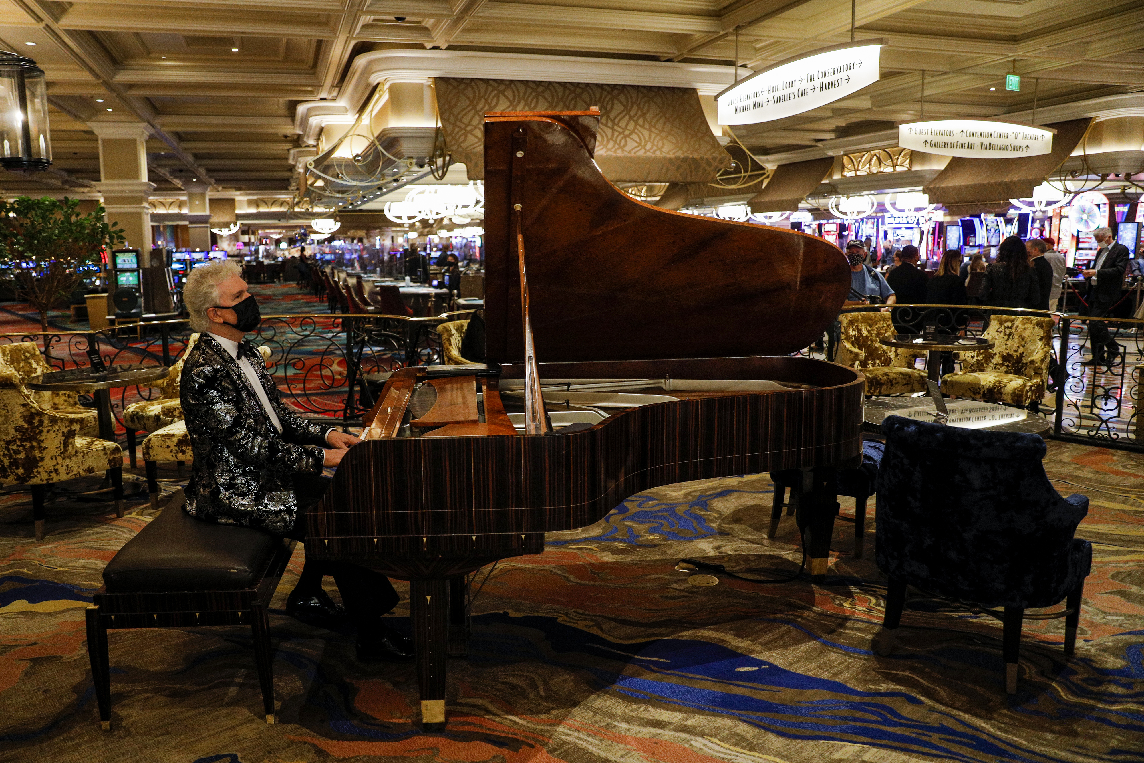 All eyes will be on the May jobs report, but investors are more focused on signs the global economy is reopening. Here, a performer plays piano while wearing a protective mask at the Bellagio Hotel and Casino in Las Vegas, Nevada, U.S., on Thursday, June 4, 2020, as gaming venues welcome back the public. Wire photography: Joe Buglewicz—Bloomberg via Getty Images