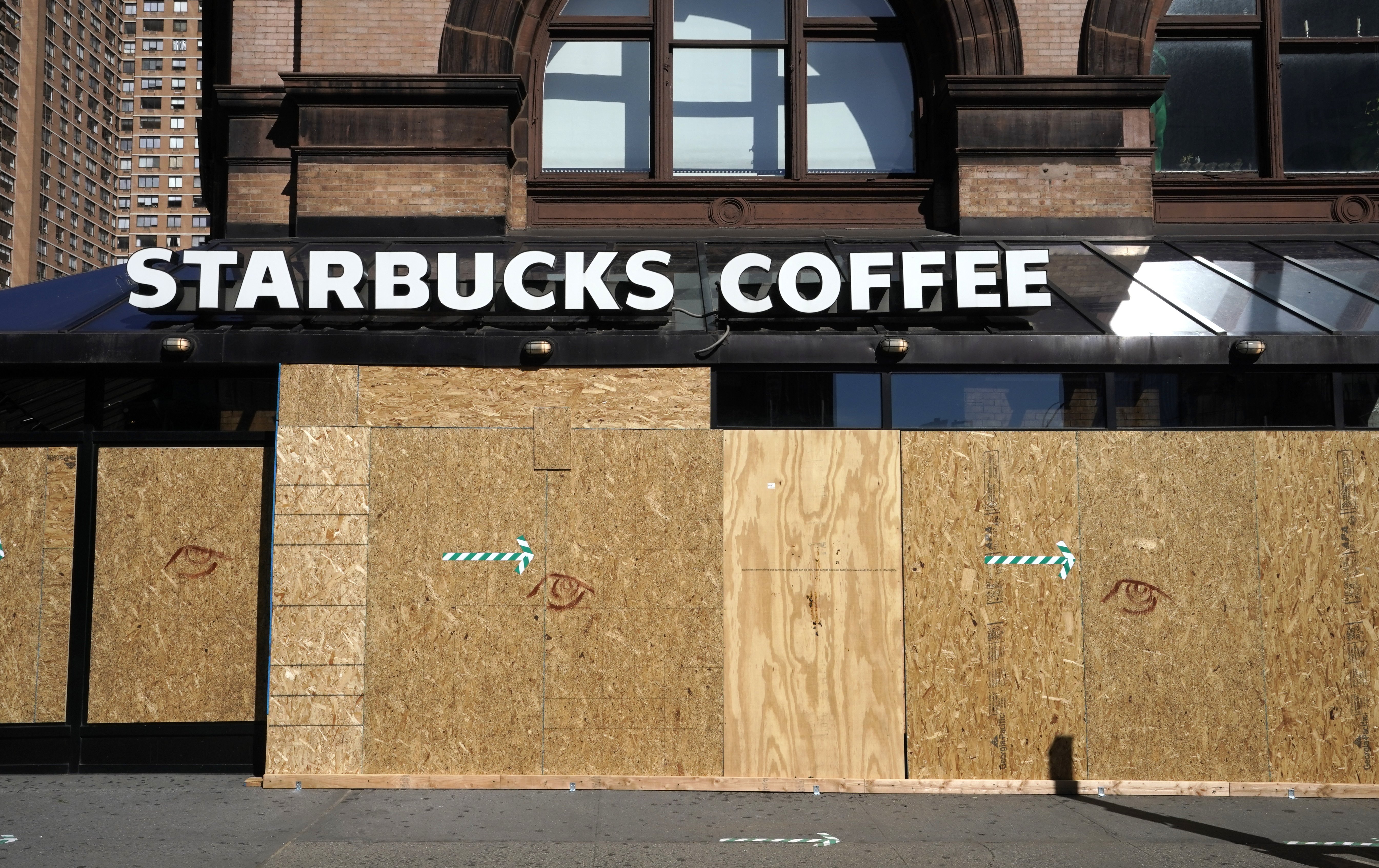 A Starbucks coffee store is seen boarded up on June 8, 2020 after rampant open looting and vandalism in New York, following the Minneapolis police killing of George Floyd. - Today New York City enters "Phase 1" of a four-part reopening plan after spending more than two months under lockdown. New York City is the final region in the state to reopen its economy. (Photo by TIMOTHY A. CLARY / AFP) (Photo by TIMOTHY A. CLARY/AFP via Getty Images)
