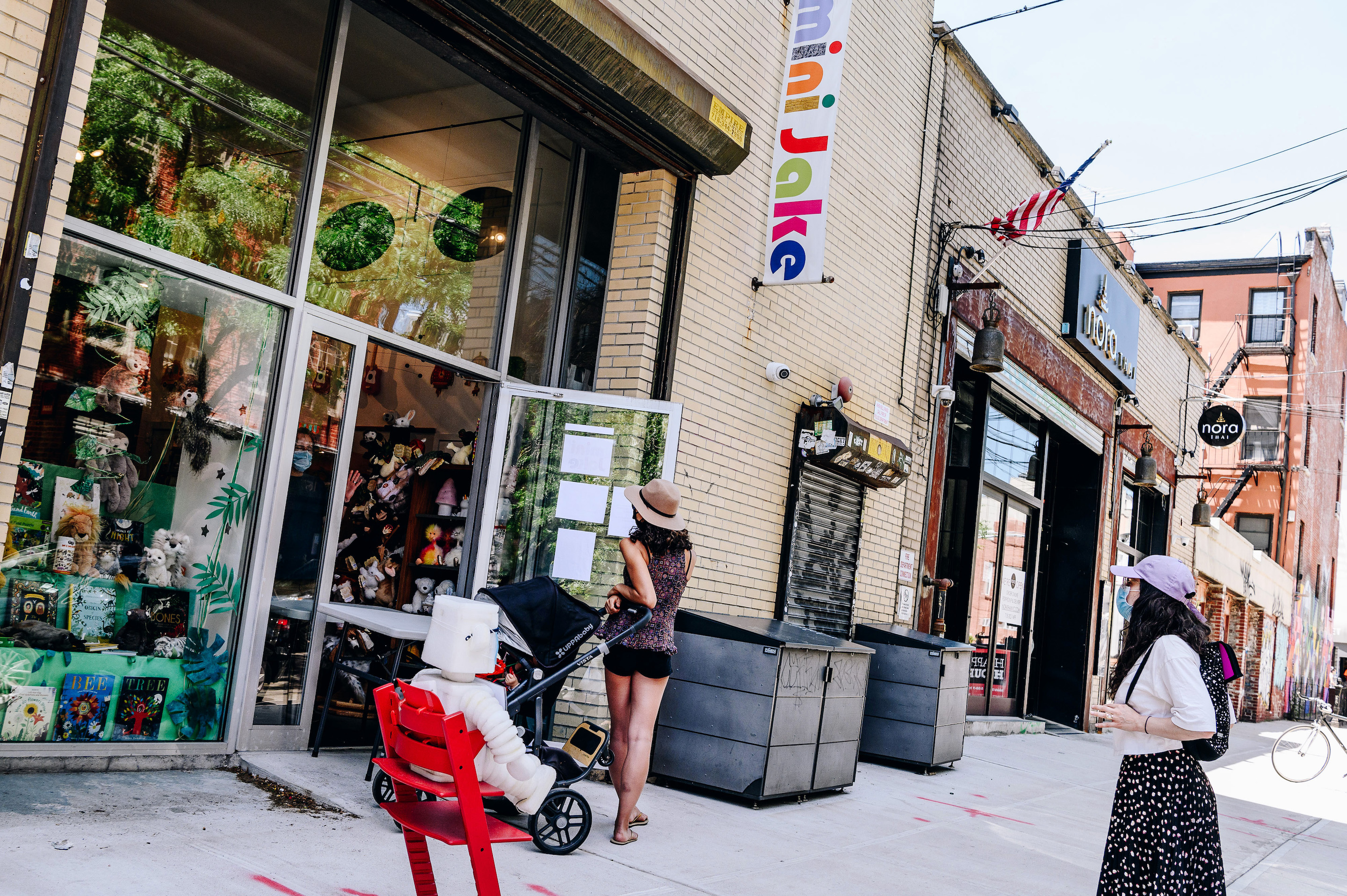Pedestrians wearing protective masks stand in line outside a store open for curbside pickup in the Williamsburg neighborhood in the Brooklyn borough of New York, U.S., on Monday, June 8, 2020. Only 1.2% of New Yorkers tested Sunday were infected with the new coronavirus, the lowest rate since the pandemic began. "Why are we reopening? Because these numbers say we can," Governor Andrew Cuomo said said at a news conference in Manhattan. Photographer: Nina Westervelt/Bloomberg