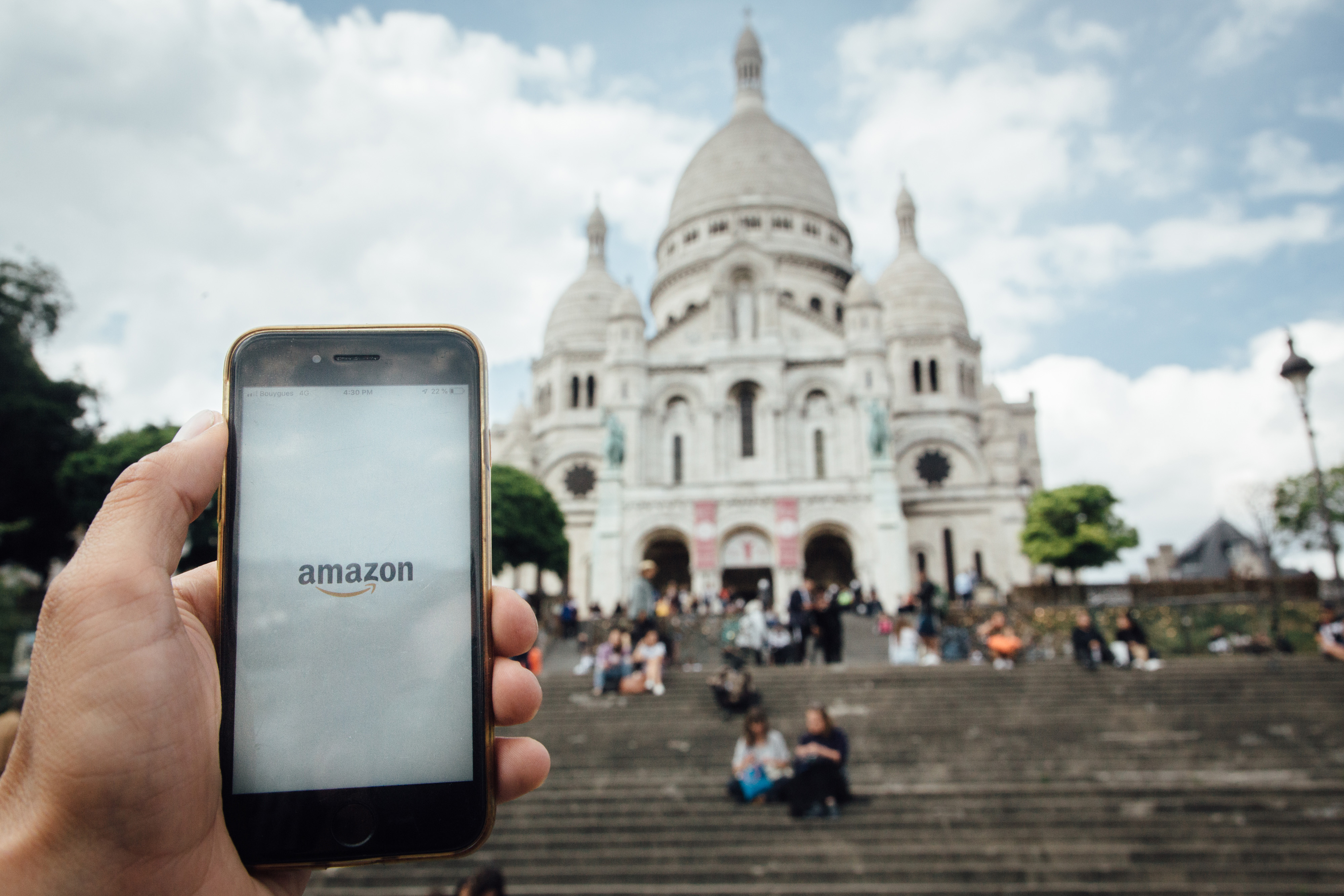 The Amazon.com Inc app is displayed on a Apple Inc. smartphone near Le Sacre Coeur basilica in Paris, France. On Monday, economists issued a new call to raise taxes on multinationals to help finance a coronavirus recovery, a move targeting the tech giants. Wire photography: Cyril Marcilhacy—Bloomberg via Getty Images