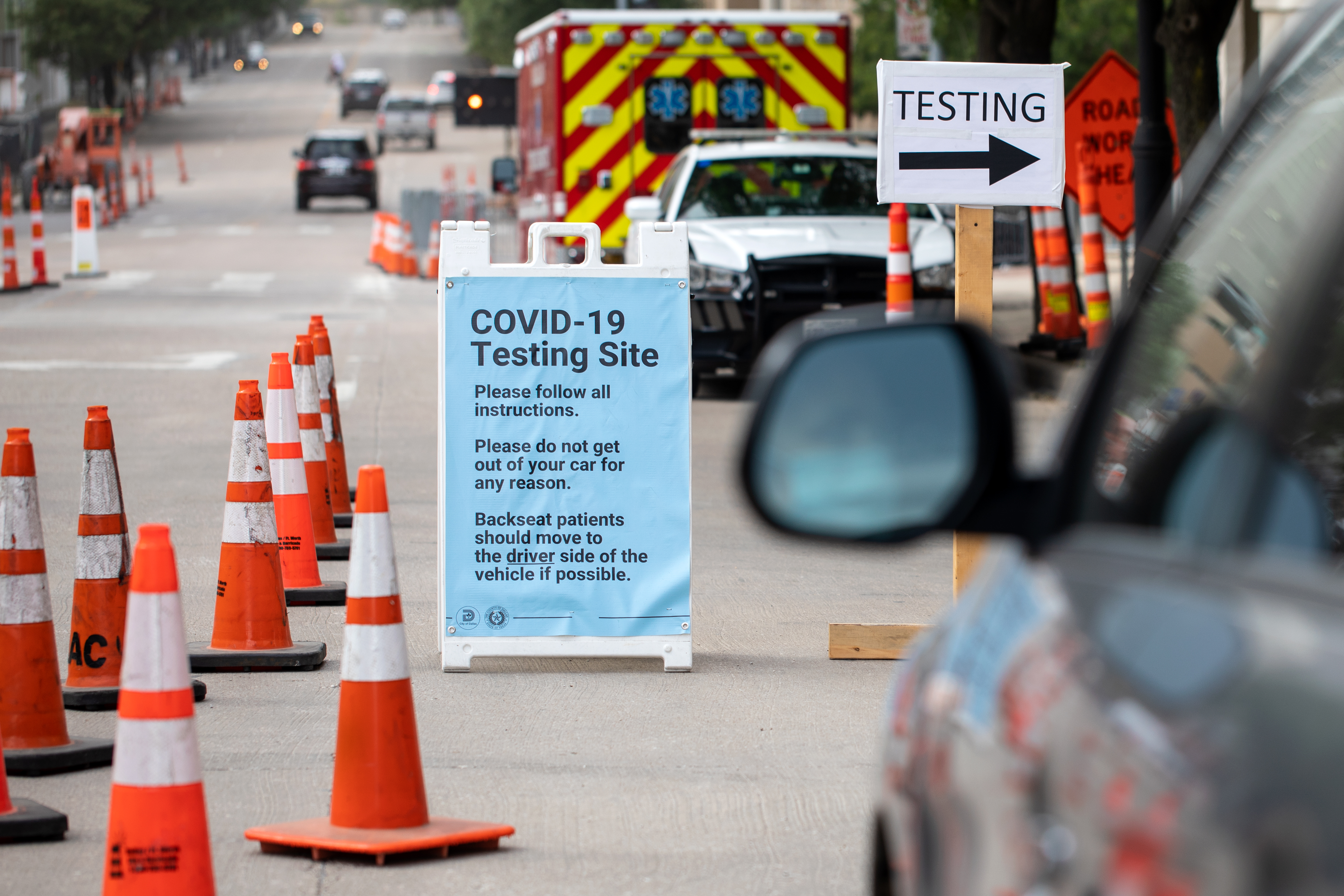 Cars wait in line at a drive up COVID-19 testing site inside the American Airlines Center parking garage in Dallas on June 27, 2020. Texas is facing a surge of new cases of COVID-19 after the state government allowed business to open prematurely. Wire photography: Montinique Monroe—Getty Images