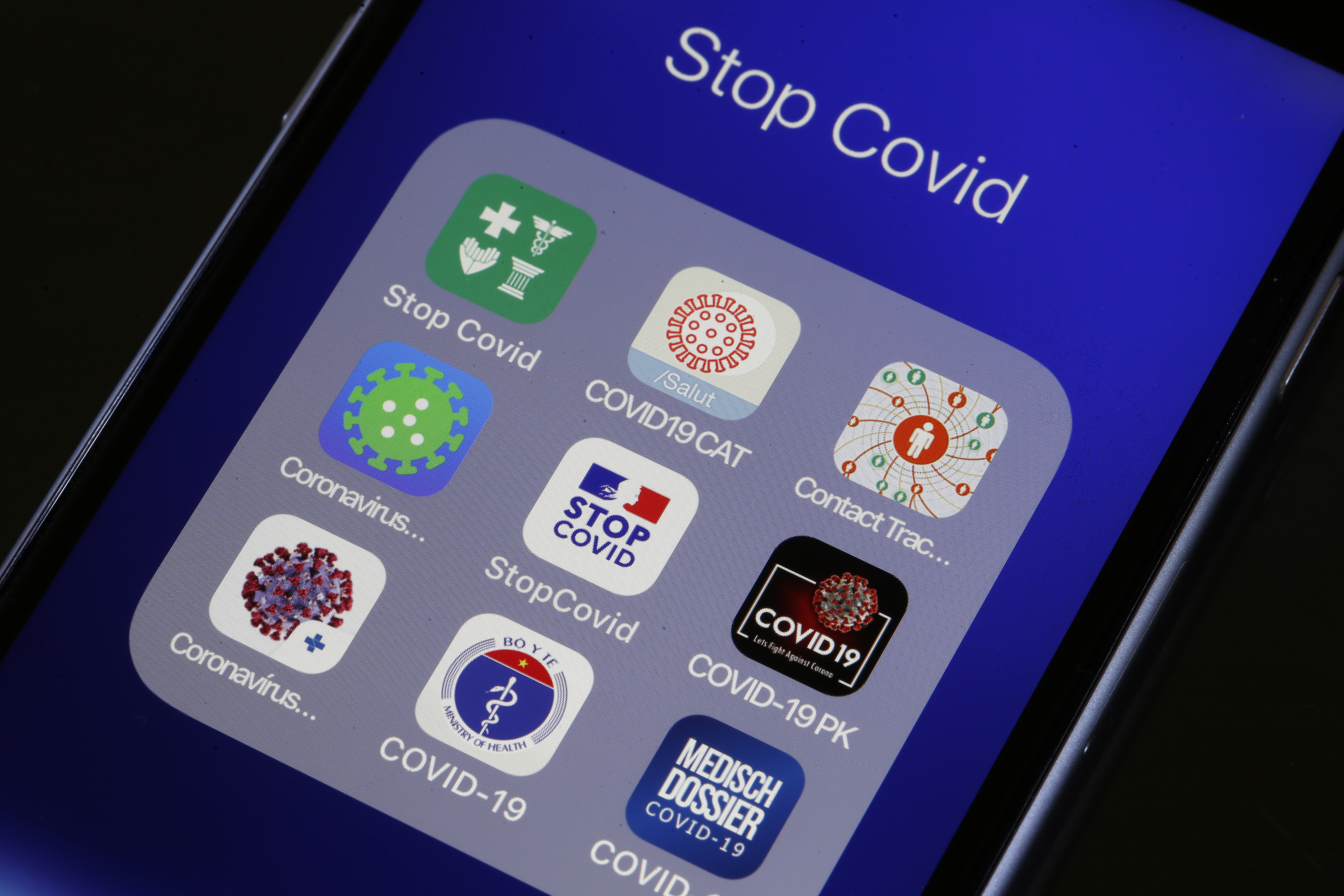 A smartphone displays several coronavirus-related applications, developed to trace people who test positive for COVID-19. Many people are worried about the privacy implications of such technology.Chesnot/Getty Images