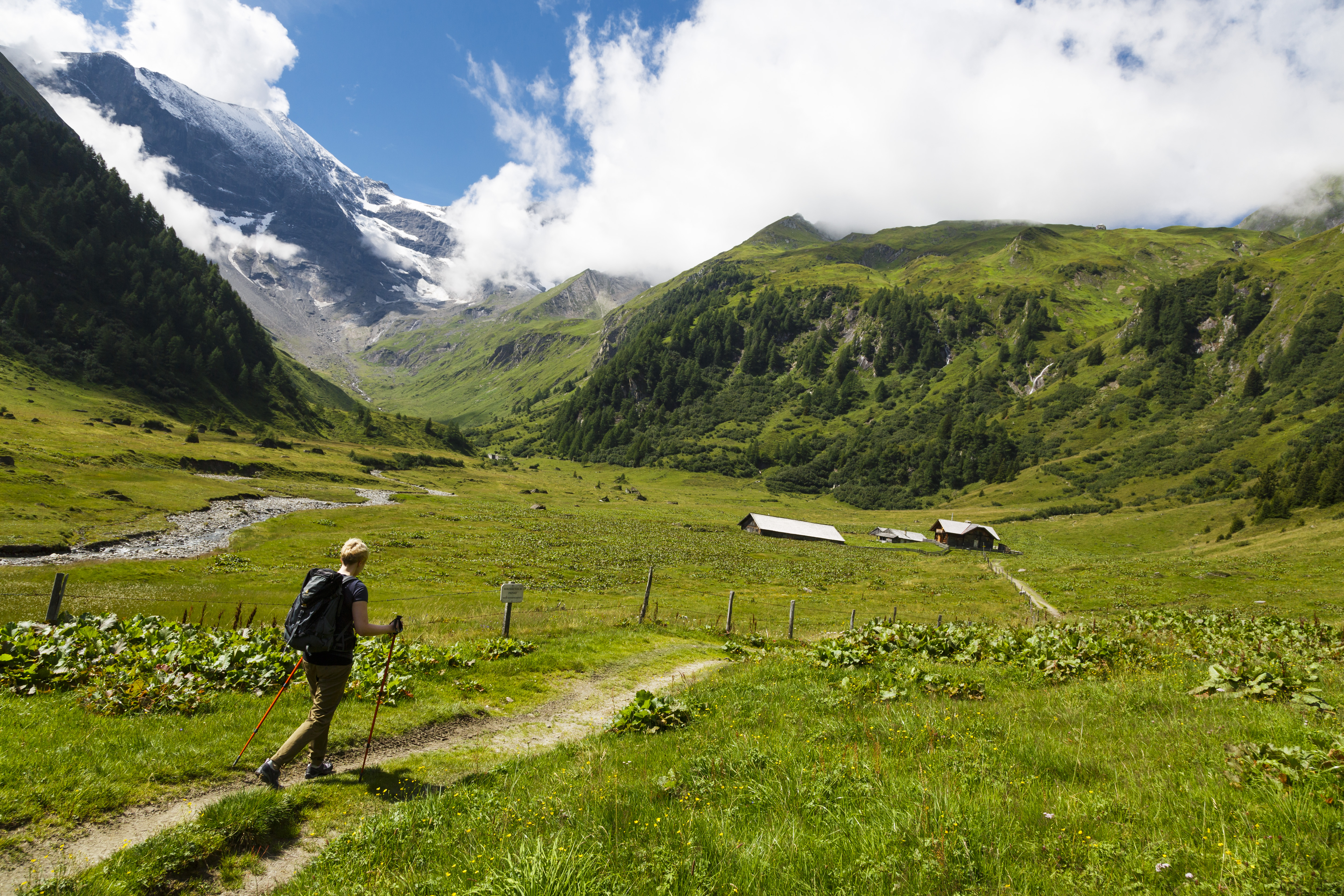 A young woman hikes near the summit of the Hoher Tenn, a double-peaked mountain in the Austrian Central Alps, in Fusch, Austria. The eurozone's sixth largest economy is drafting new laws that’ll redistribute billions of euros toward more ecologically-friendly activities. Wire photography: Thomas Trutschel—Photothek via Getty Images