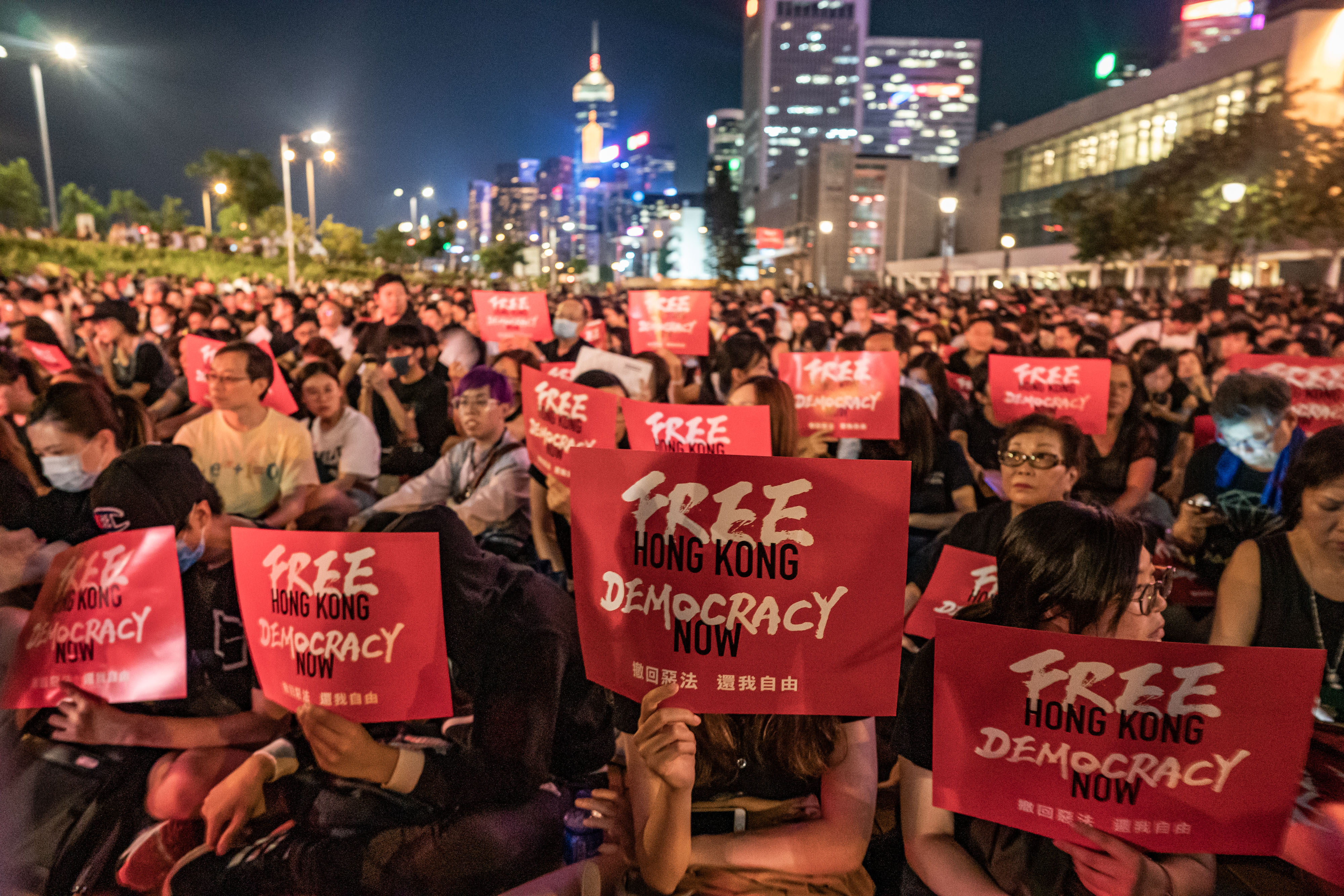 Protesters in Hong Kong hold placards as they take part in a rally against the extradition bill ahead of the 2019 G20 Summit. Western technology companies are signalling that they will not comply with data requests from Chinese authorities after the passage of a new law widely seen as restricting free speech in the Chinese territory.