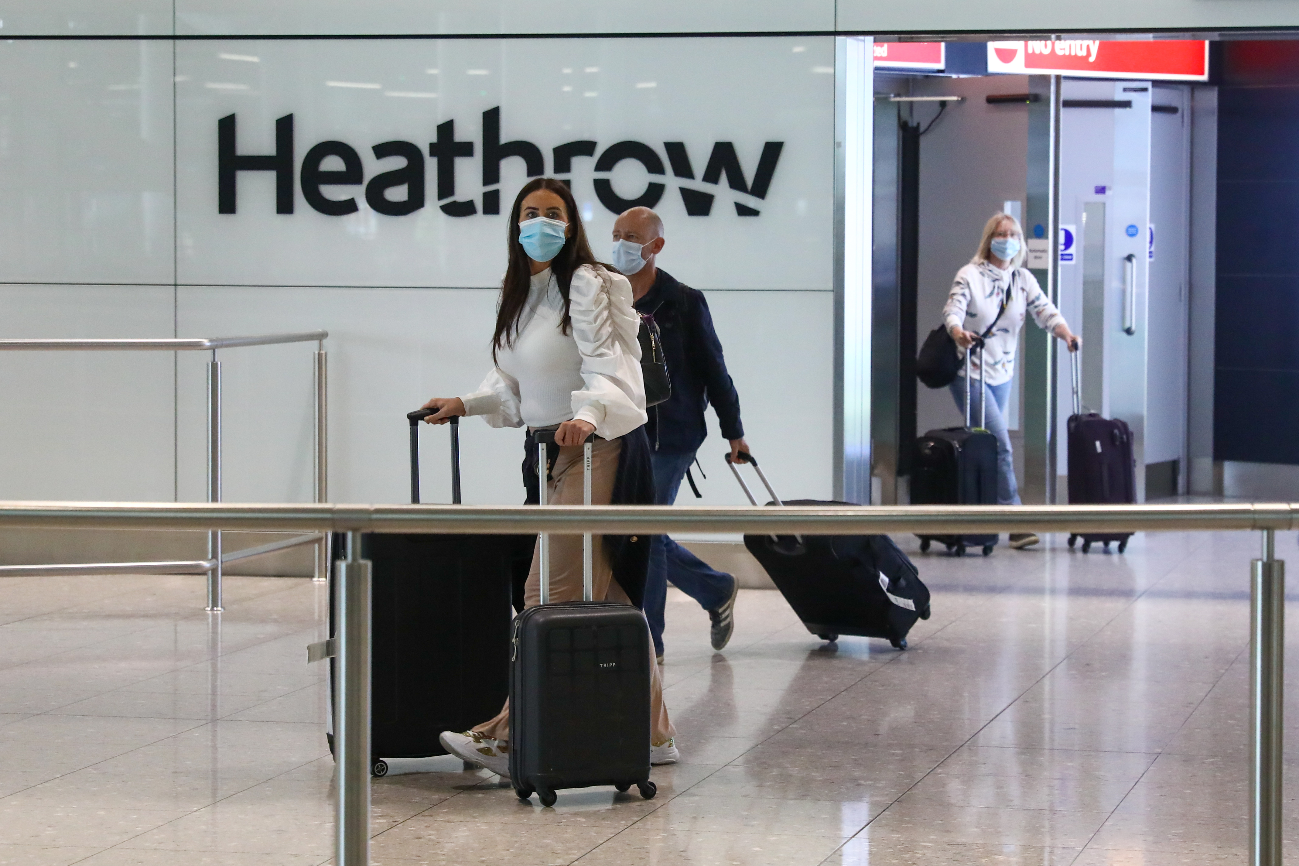 Passengers, wearing protective face masks, walk through the international arrivals hall after arriving at Terminal 2 at London Heathrow Airport in London, U.K., this month. London Heathrow is set to pilot on-site coronavirus testing for air passengers. Wire photography: Simon Dawson—Bloomberg via Getty Images