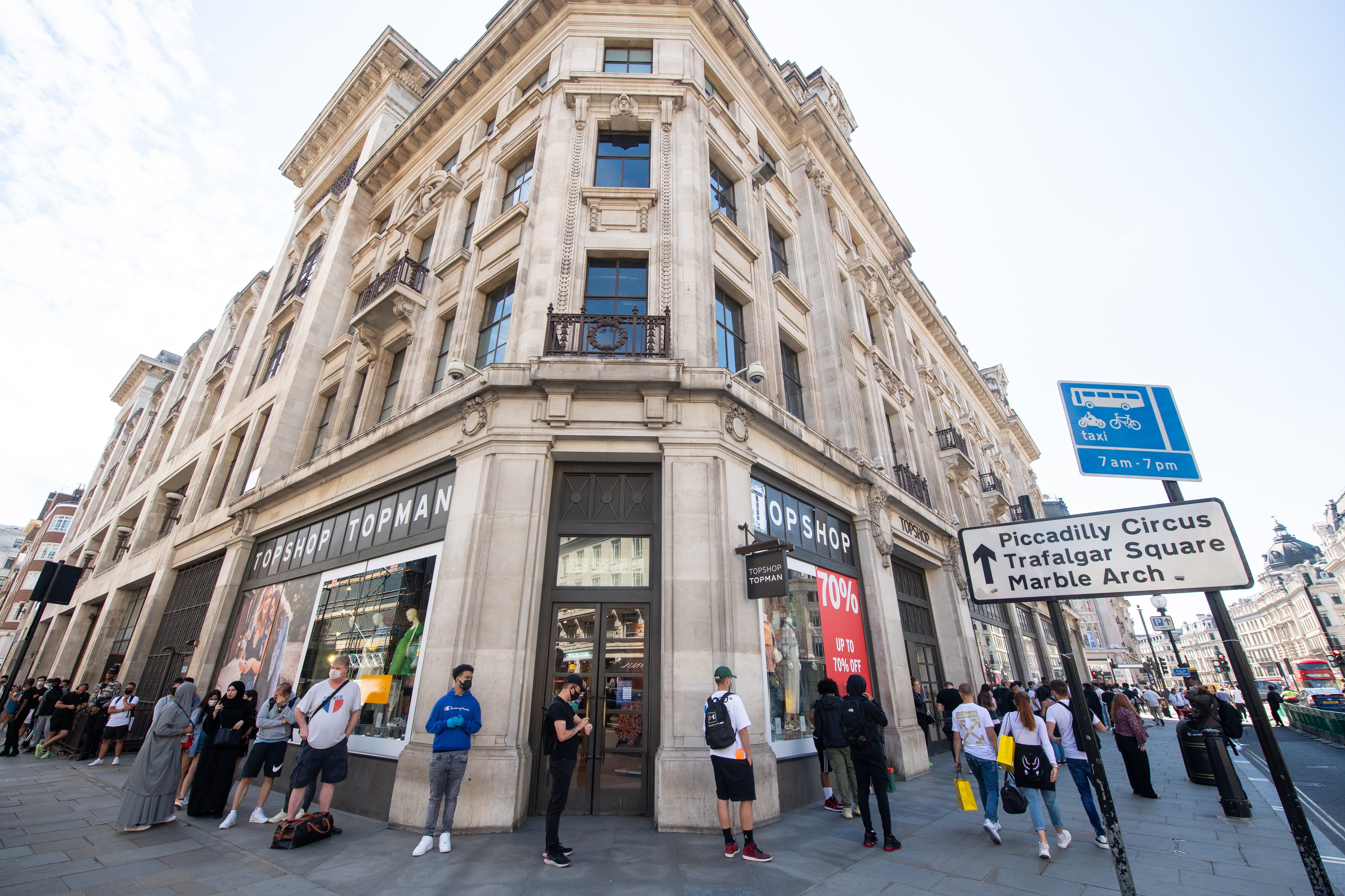 People queue around the block for Nike Town on Oxford Circus, London, as non-essential shops in England open their doors to customers for the first time since coronavirus lockdown restrictions were imposed in March. (Photo by Dominic Lipinski/PA Images via Getty Images)