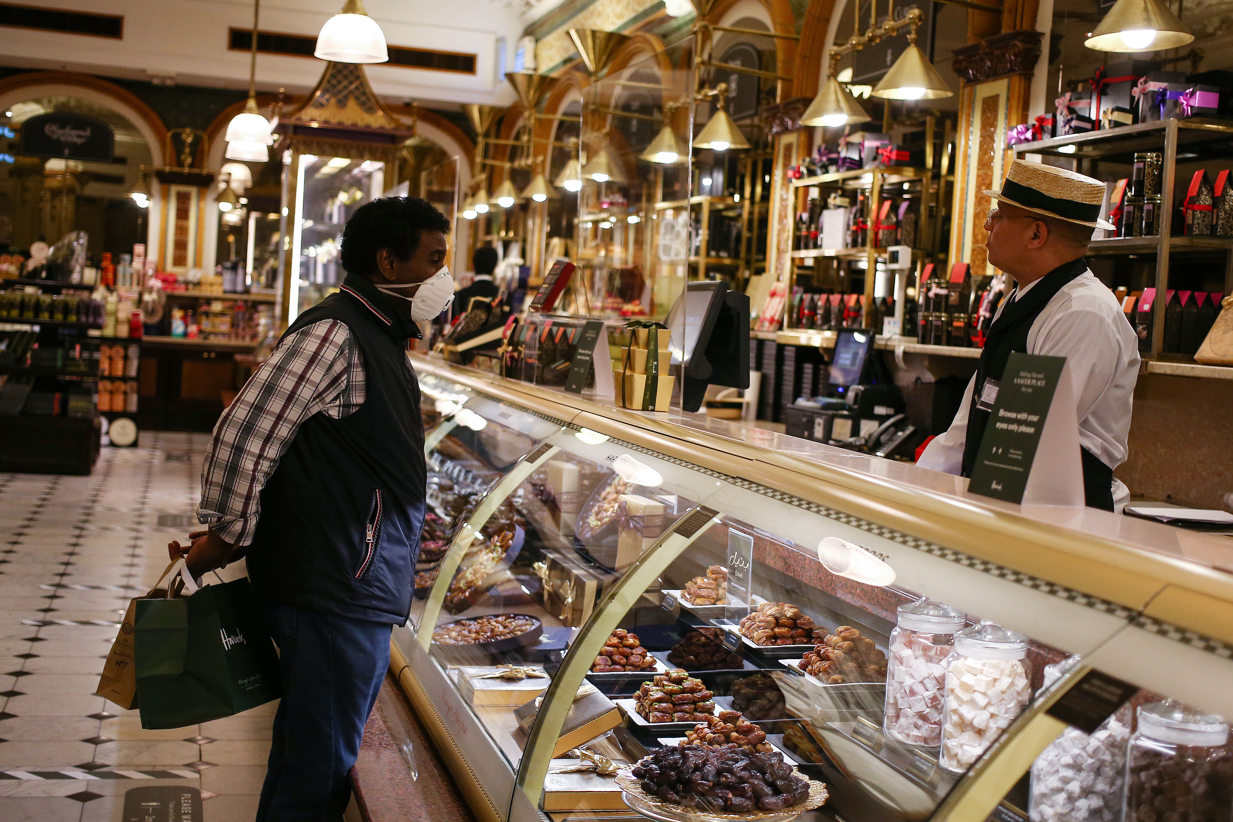 LONDON, ENGLAND - JUNE 28: Social distancing measures inside Harrods in Knightsbridge on June 28, 2020 in London, England. More retailers are reopening with social distancing measures after being shuttered for months due to the Covid-19 pandemic. Pubs and restaurants, many of which have already been serving for take-away, can fully reopen as of July 4. (Photo by Hollie Adams/Getty Images)